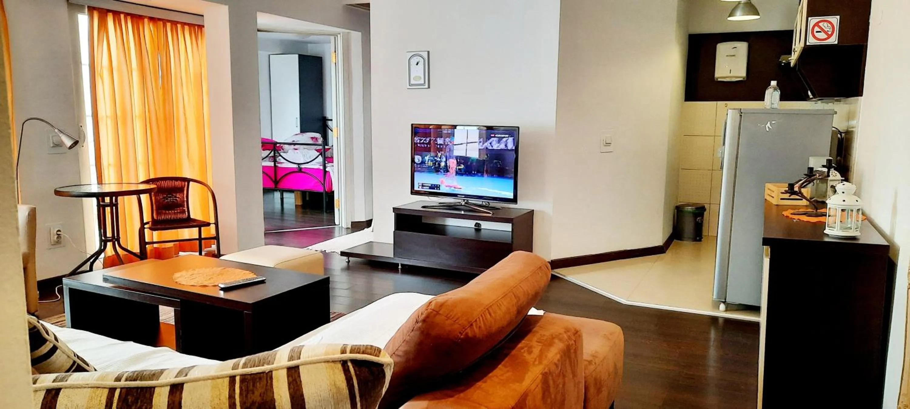 Seating area in Aloha Apartments with pool