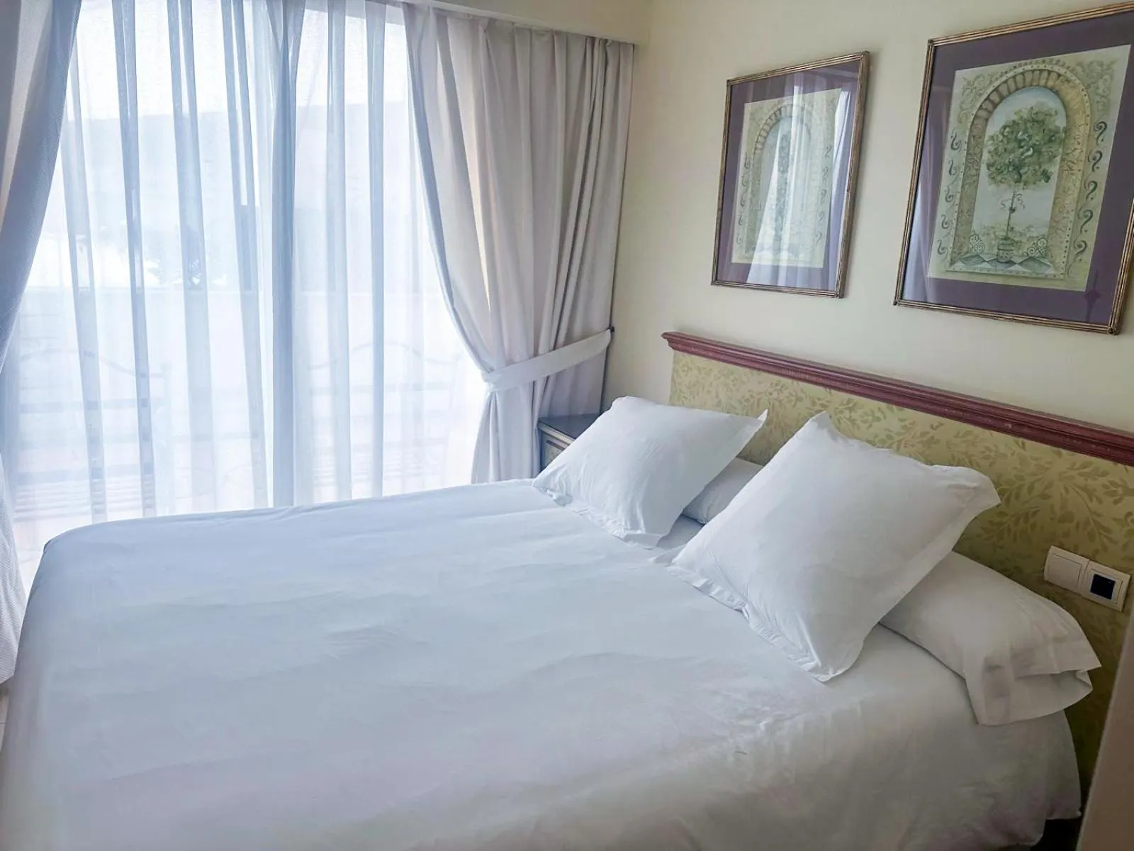 Bed in Apartamentos Guadalpin Boutique