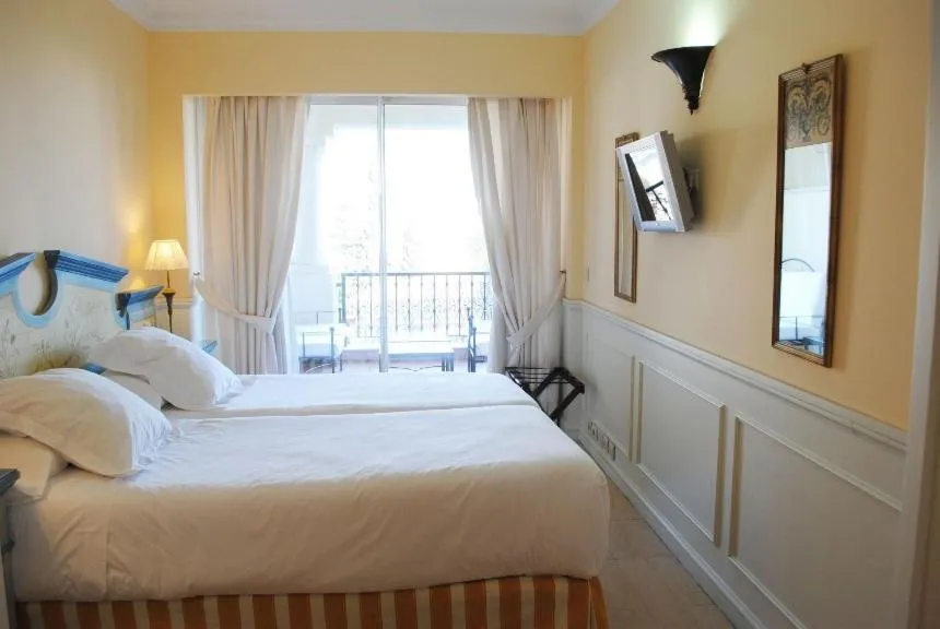 Bed in Apartamentos Guadalpin Boutique