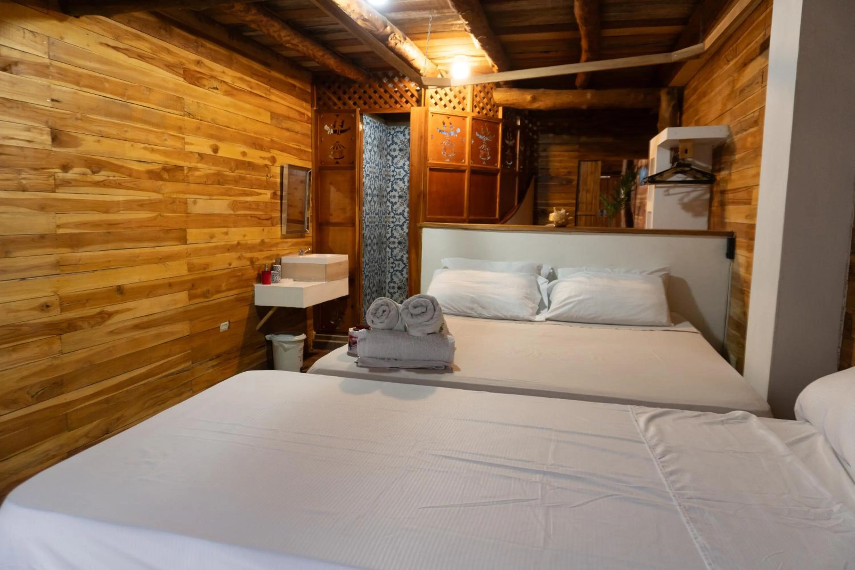 Bed in Hotel Calamari Baru