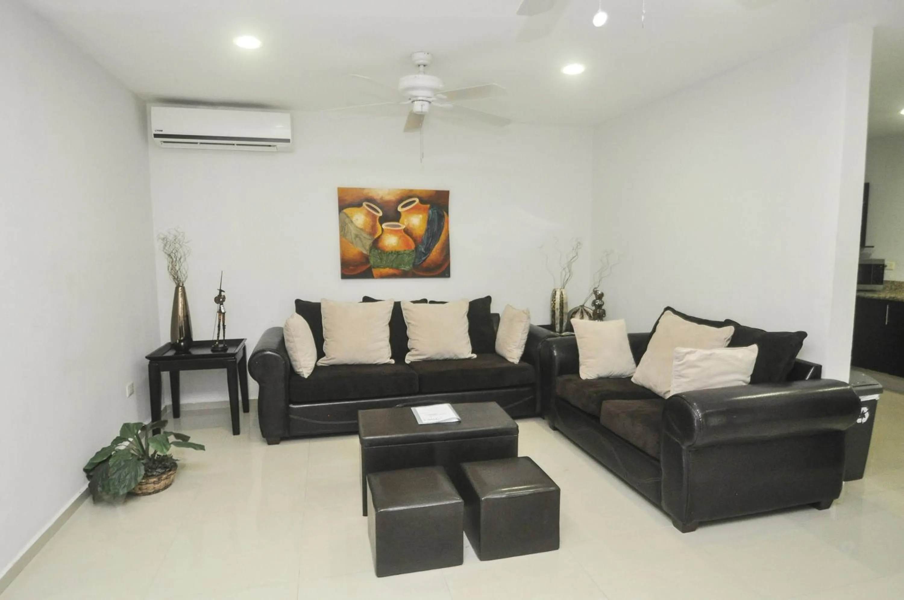 Living room in Phenomenal Location Near Beach & 5th with Stunning Roof Pool