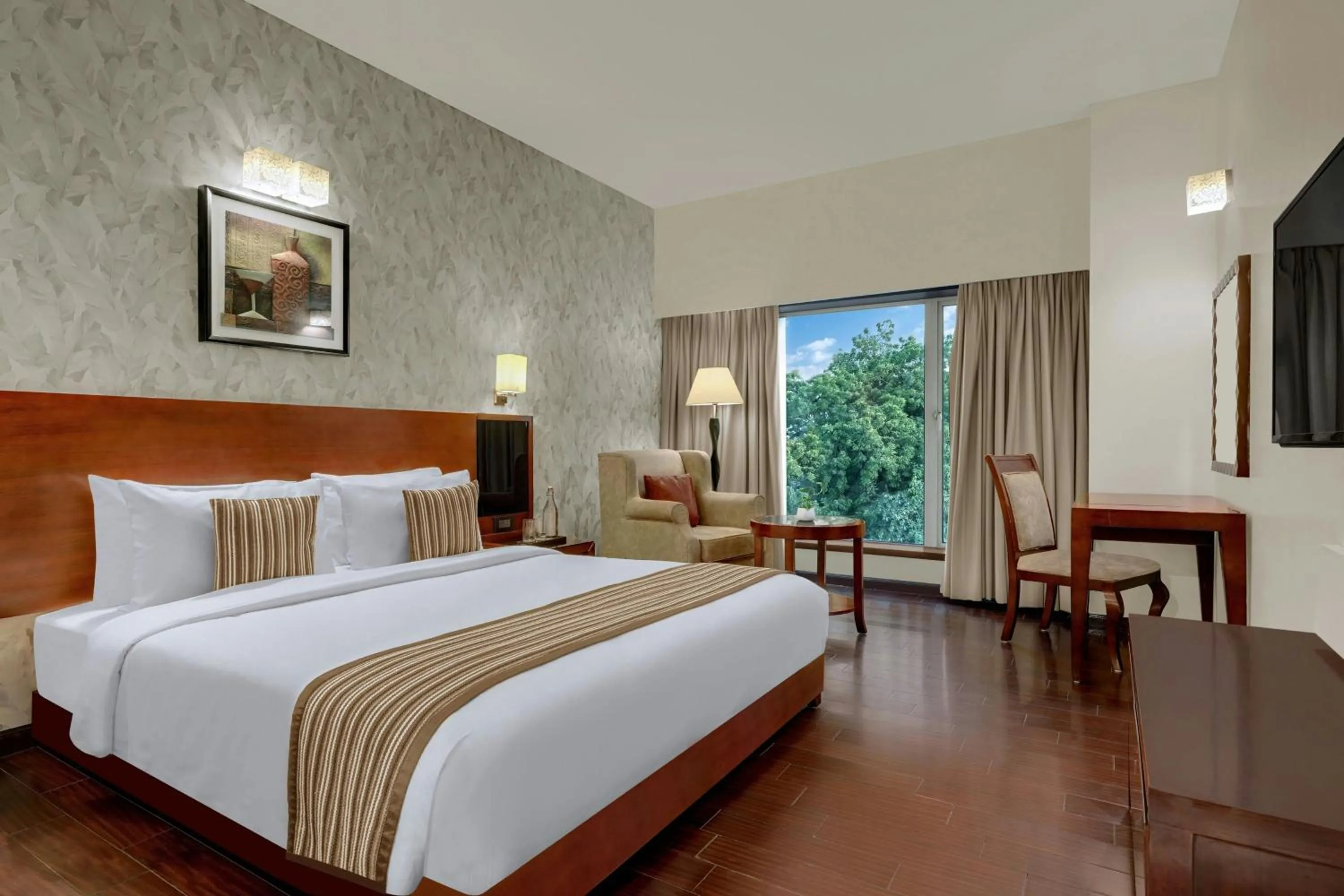 Photo of the whole room, Bed in The Fern Residency Rajkot, Series by Marriott