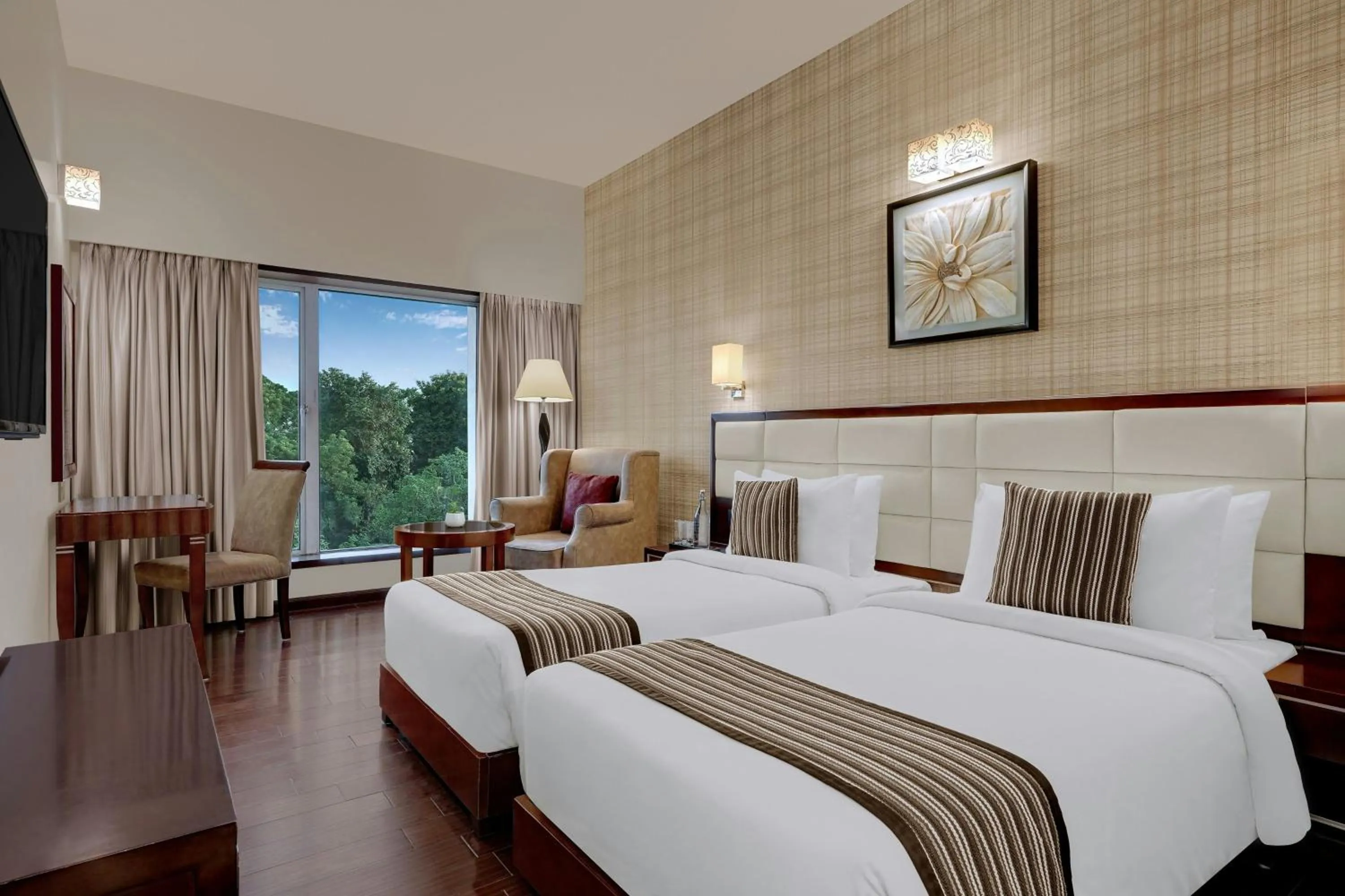 Photo of the whole room, Bed in The Fern Residency Rajkot, Series by Marriott