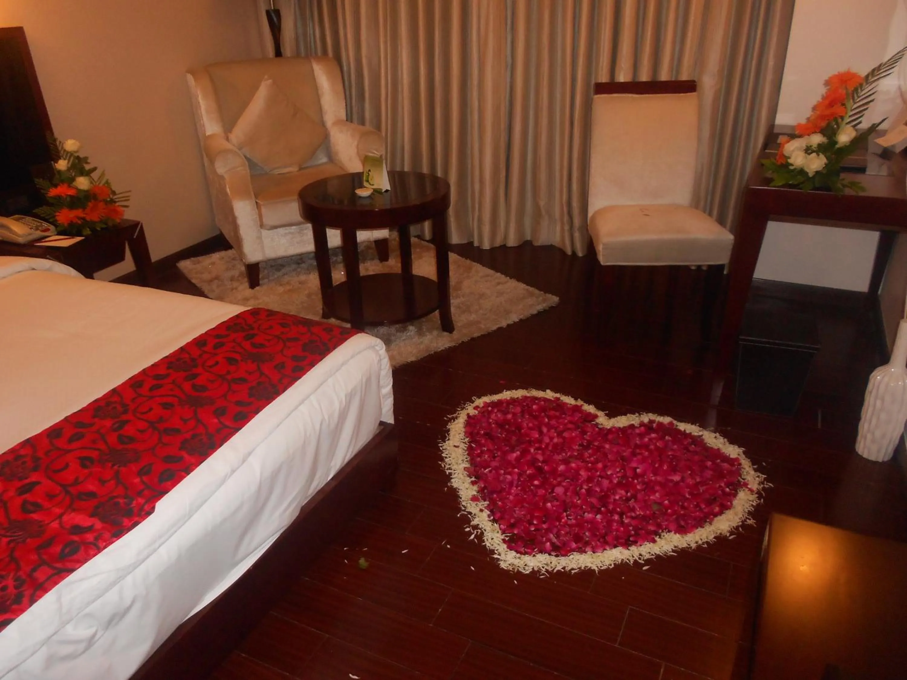 Photo of the whole room, Bed in The Fern Residency Rajkot