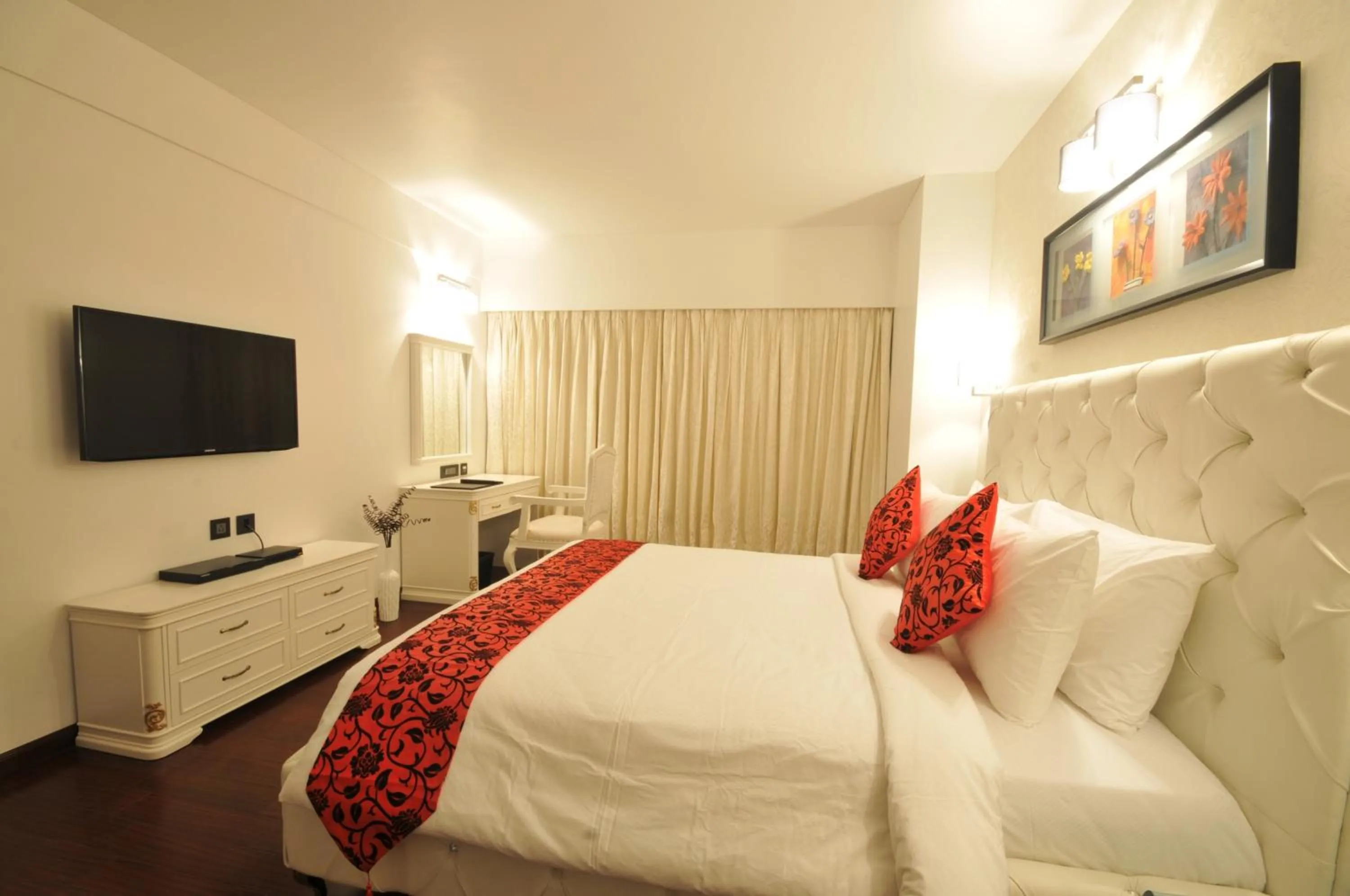 Photo of the whole room, Bed in The Fern Residency Rajkot