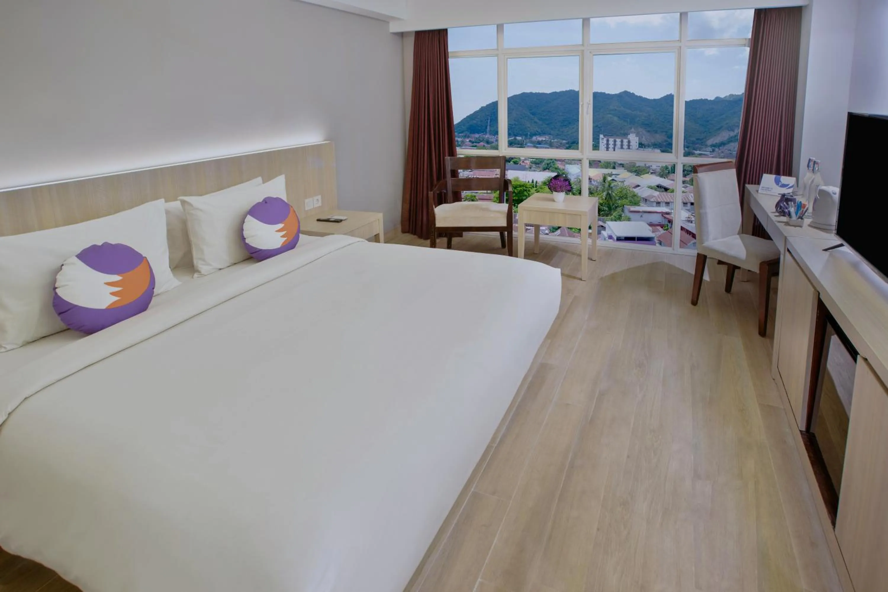 View (from property/room), Bed in Maqna Hotel By Prasanthi