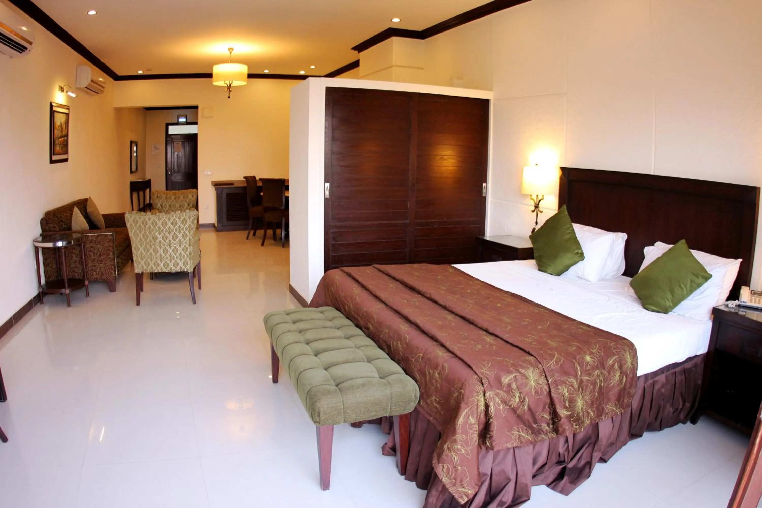 Balcony/Terrace, Bed in Dreamworld Resort, Hotel & Golf Course