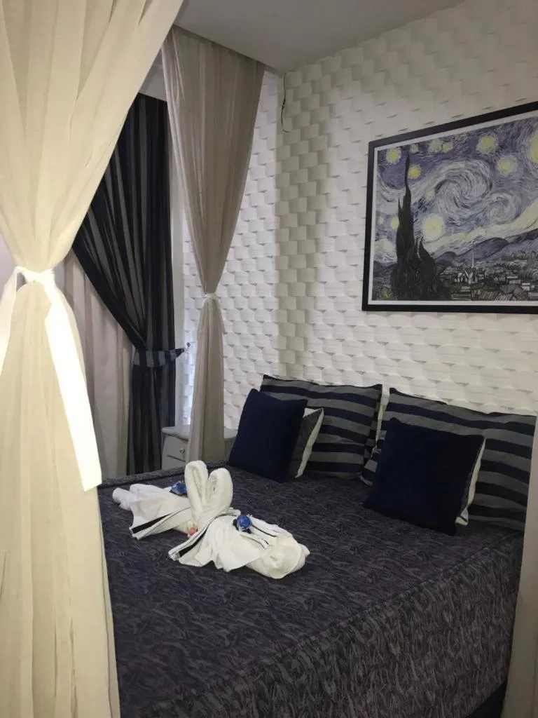 Bed in Relais de Charme Boutique Hotel Pititinga