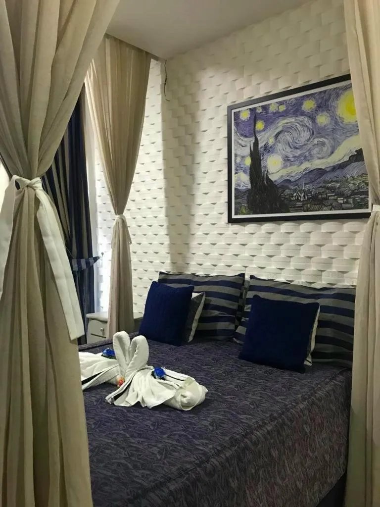 Bed in Relais de Charme Boutique Hotel Pititinga