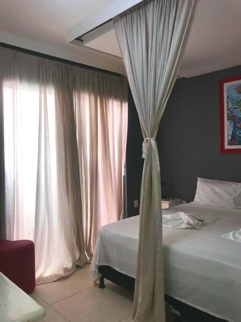 Bed in Relais de Charme Boutique Hotel Pititinga