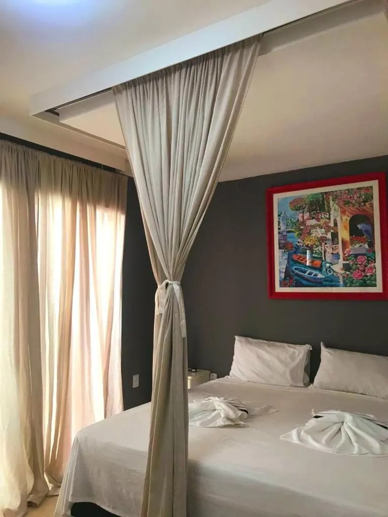 Bed in Relais de Charme Boutique Hotel Pititinga