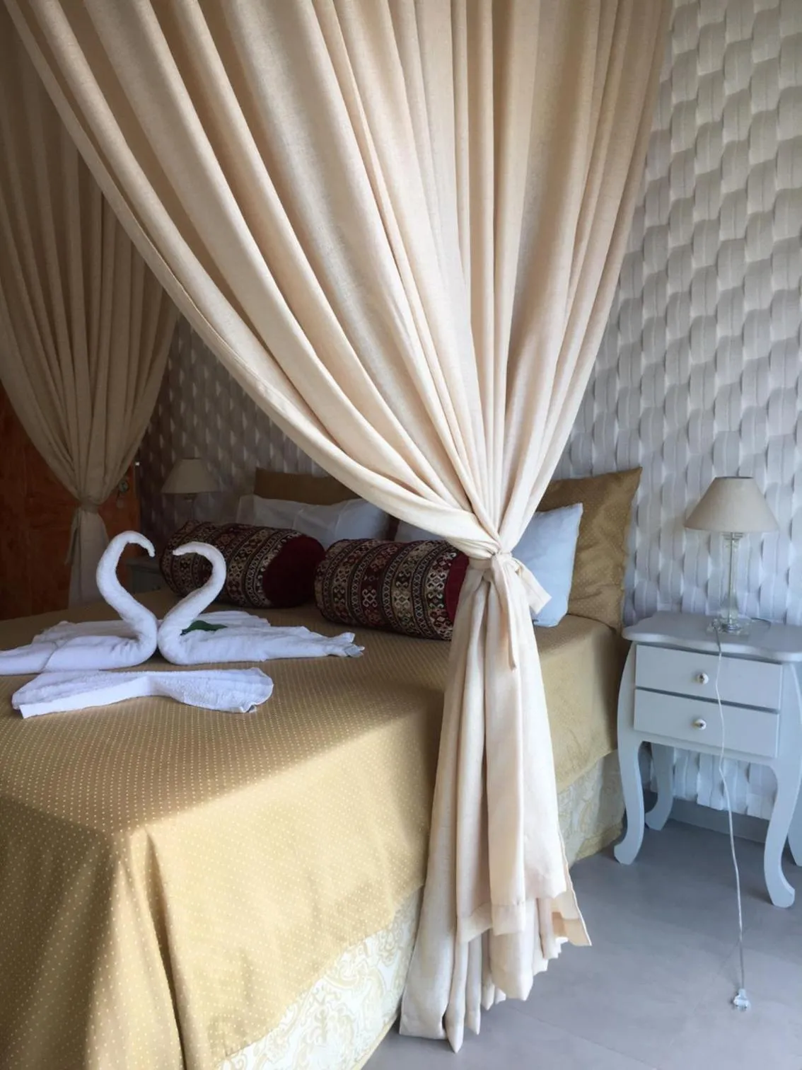 Bed in Relais de Charme Boutique Hotel Pititinga