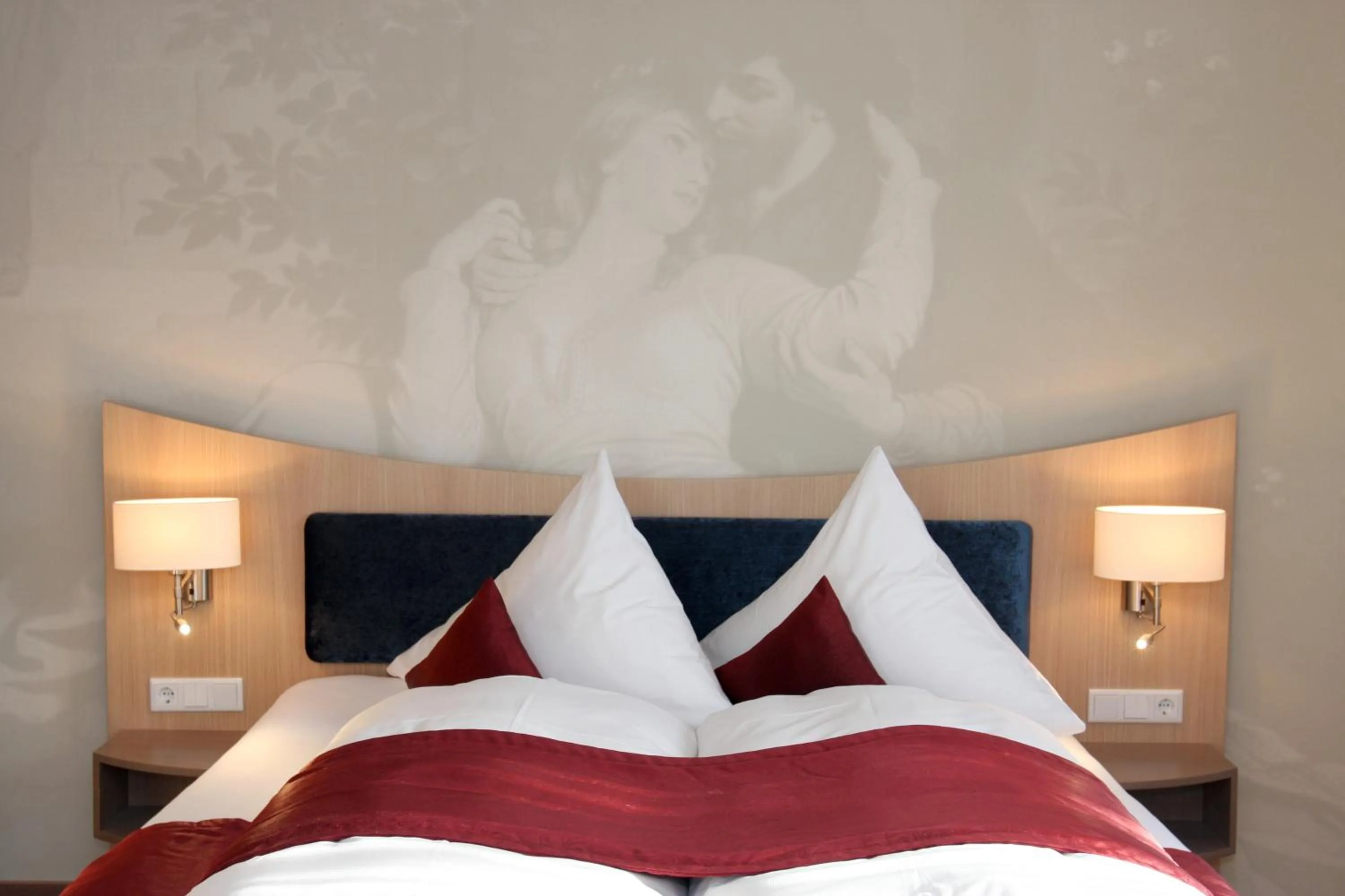 Bed in Villa Ludwig Suite Hotel