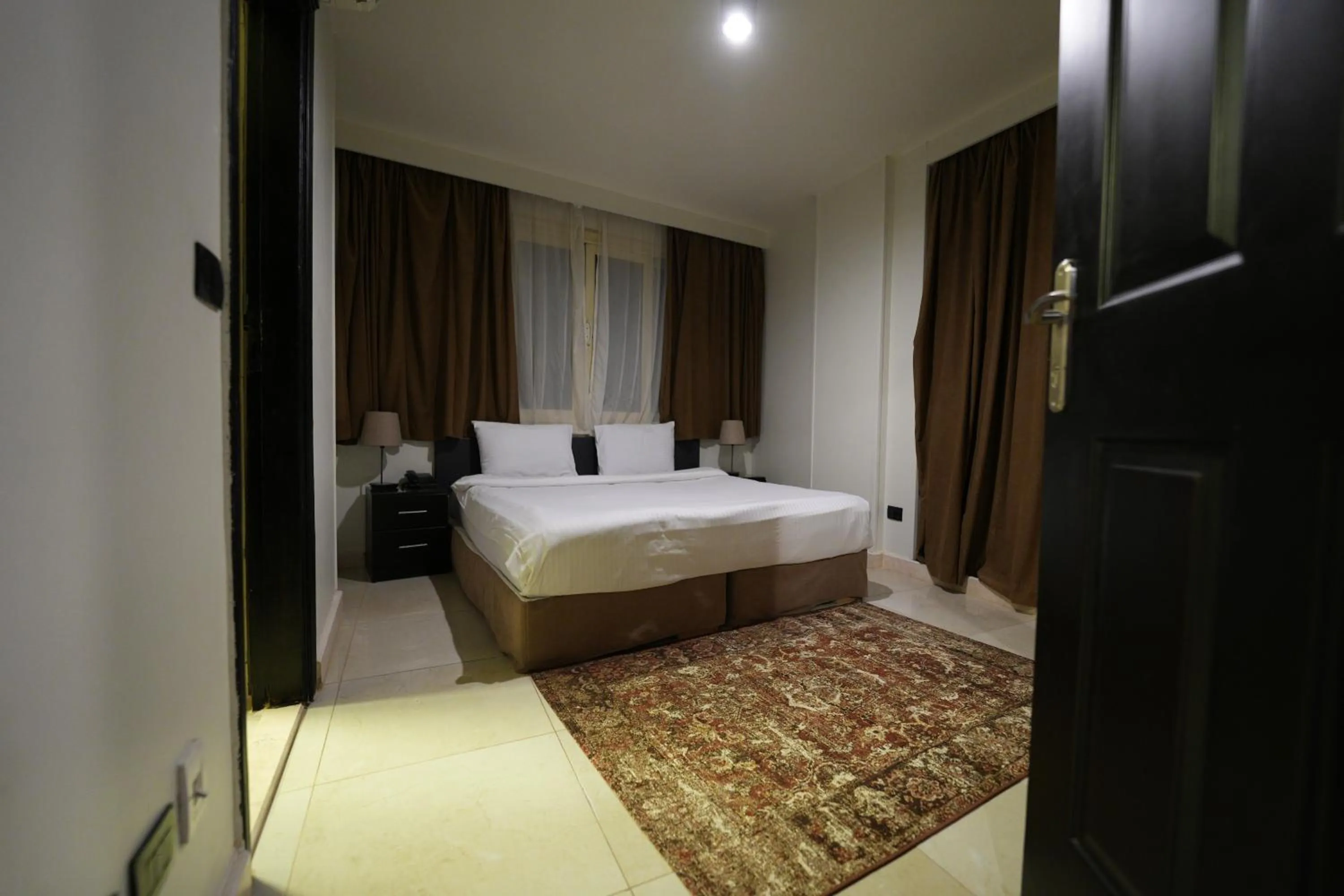 Bed in NewCity Hotel & Suites