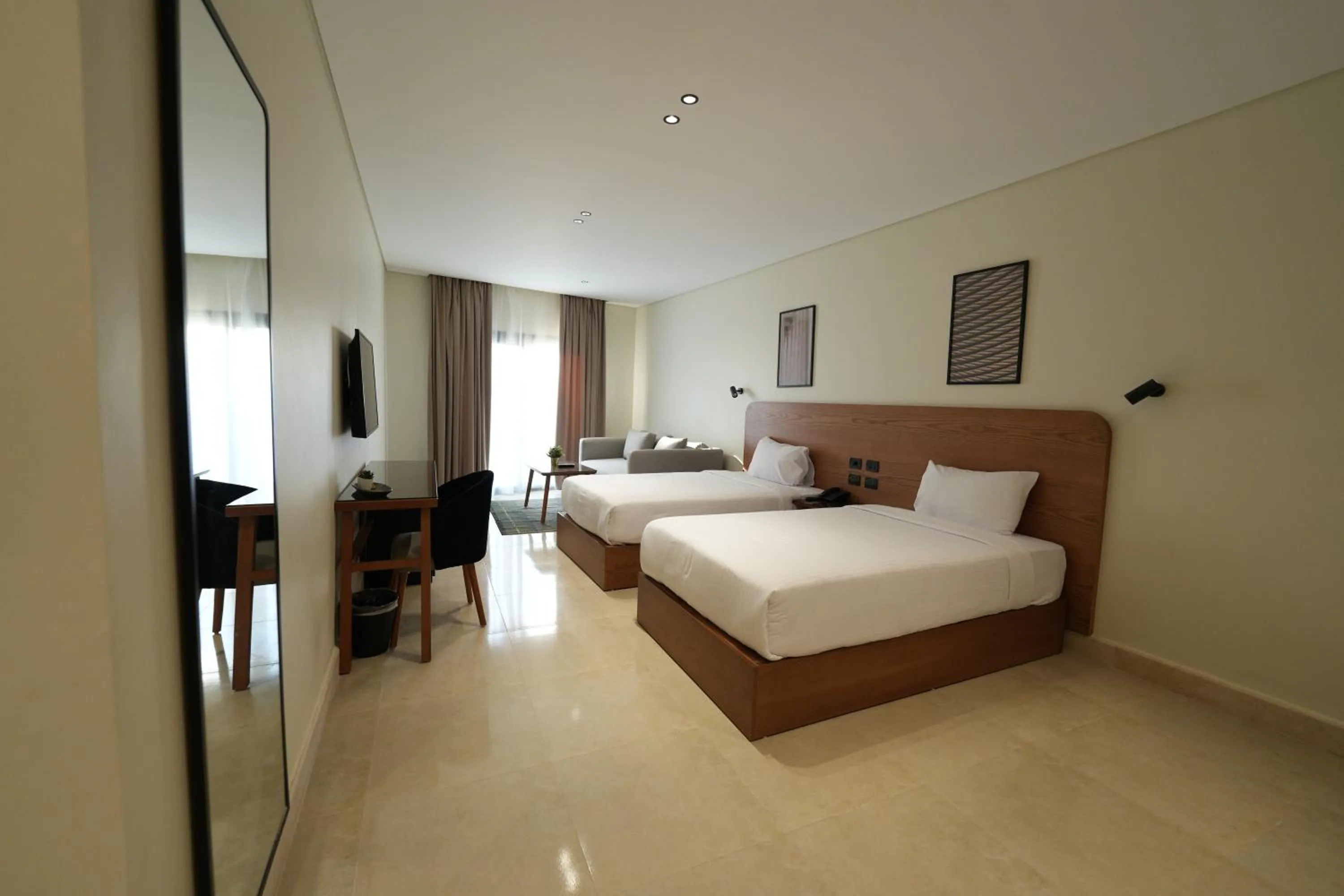 Bed in NewCity Hotel & Suites