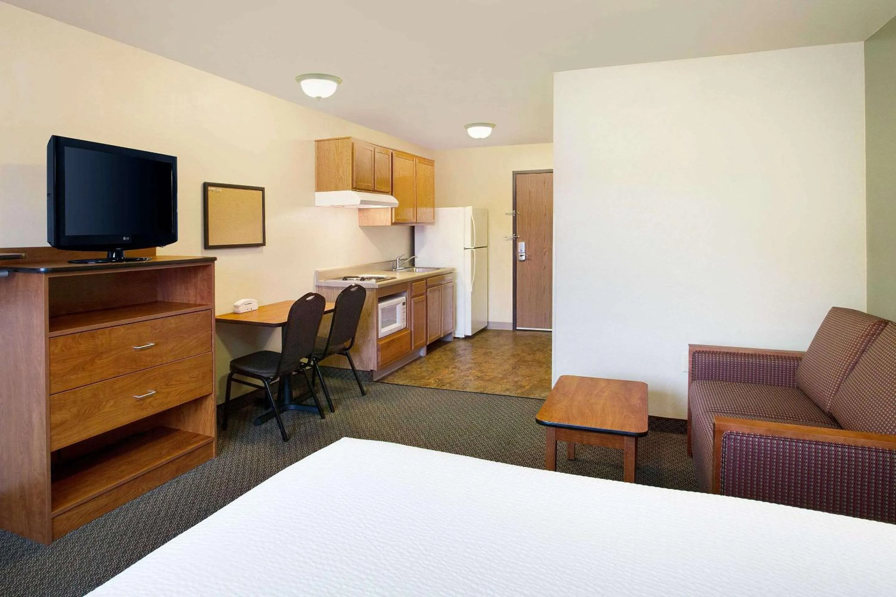 Photo of the whole room, Bed in WoodSpring Suites Raleigh Northeast Wake Forest
