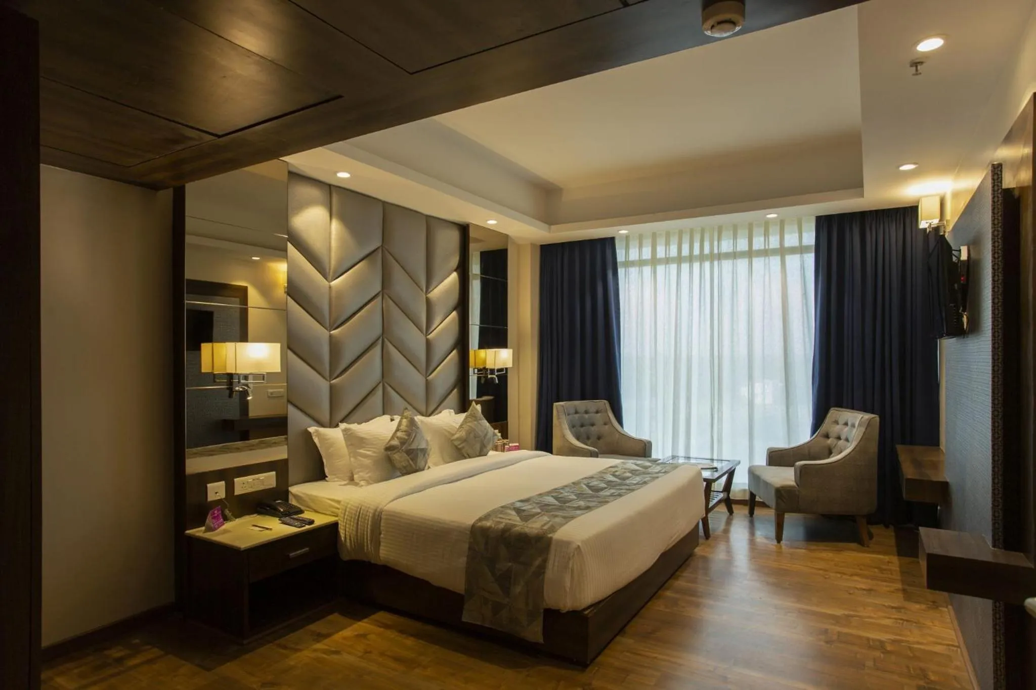 Photo of the whole room, Bed in Sarovar Portico, Somnath