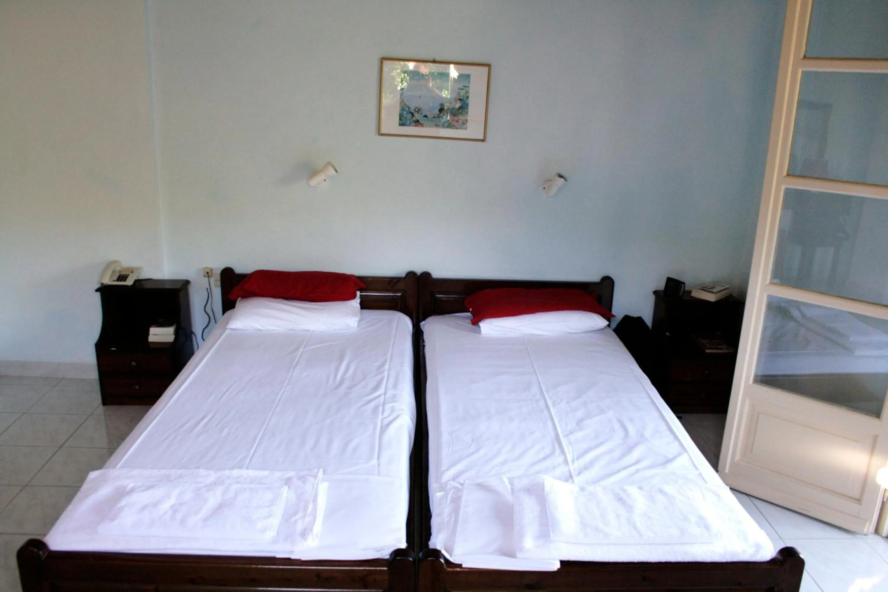 Bed in APRAOS BAY HOTEL