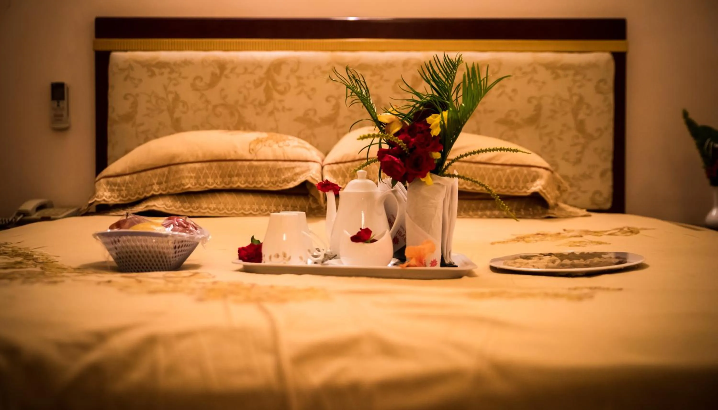 Bed in Vijayshree Resort, Hampi