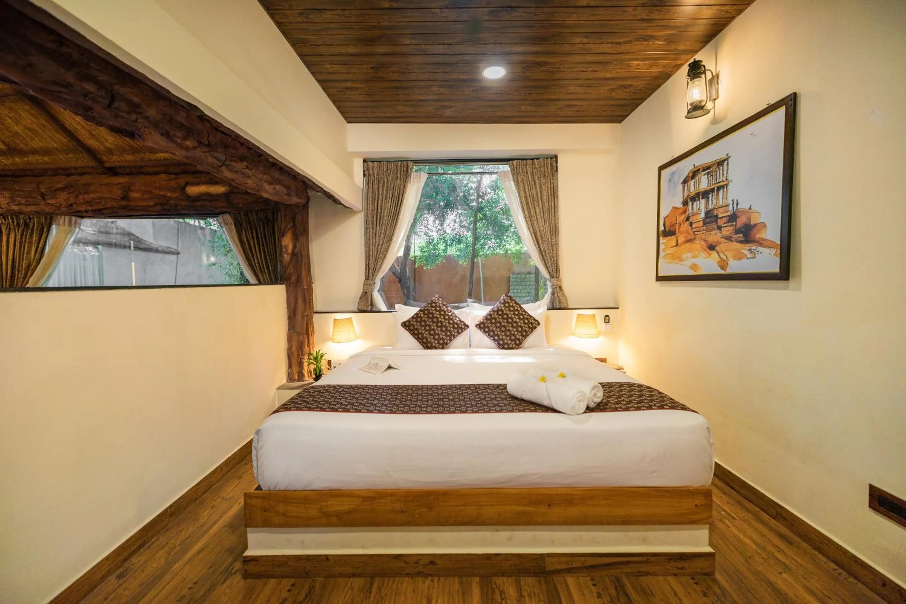 Bed in Vijayshree Resort, Hampi