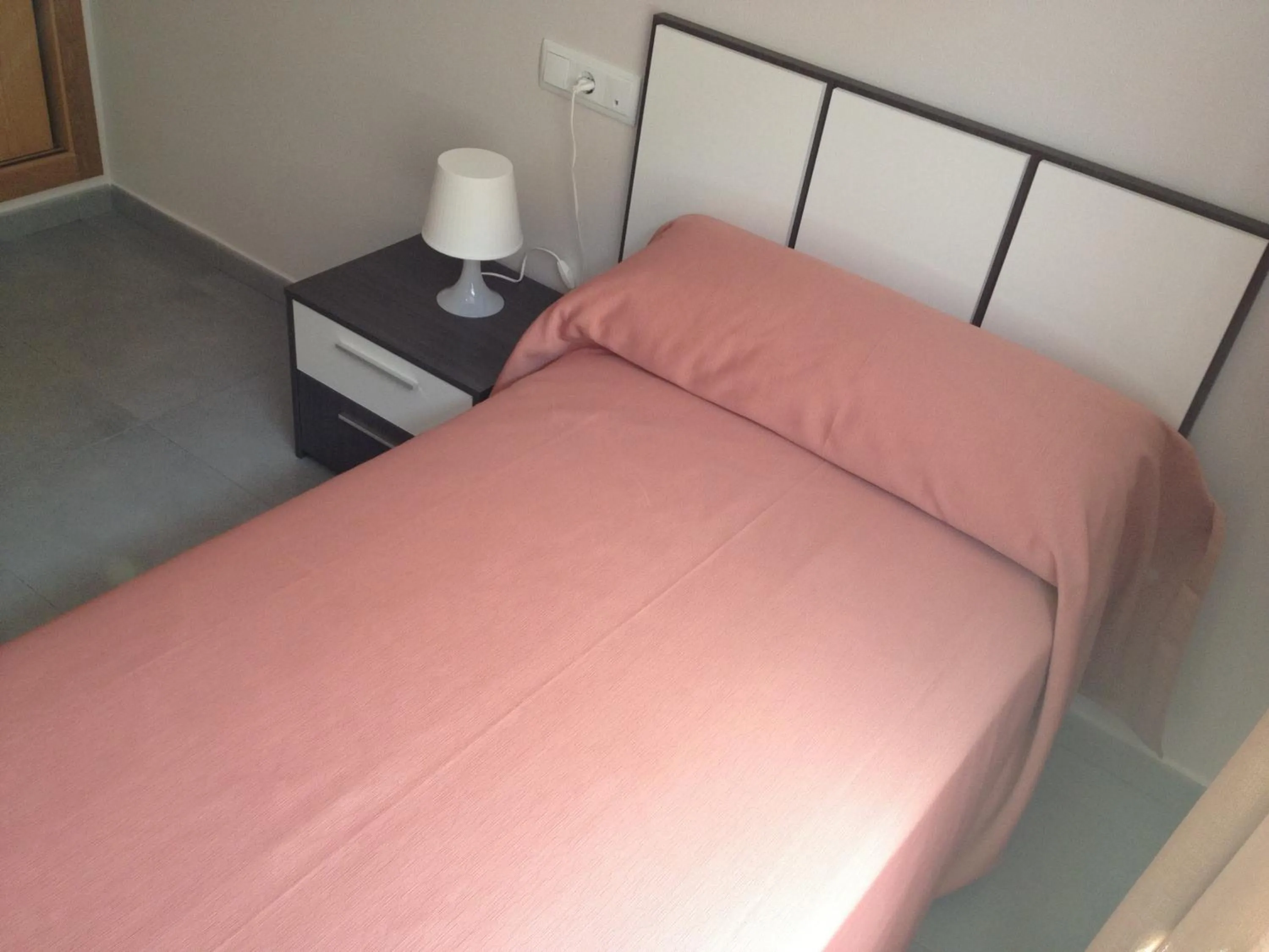 Bed in Pension La Puntica