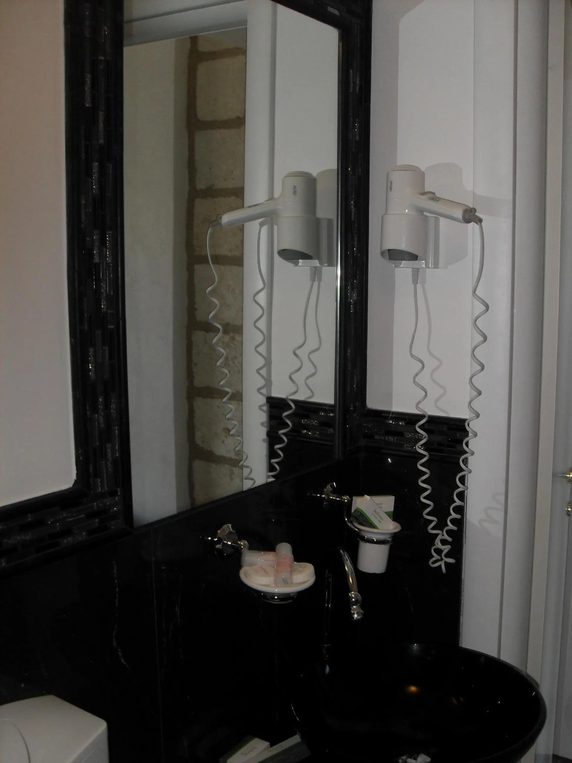 Bathroom in CapoSperone Resort