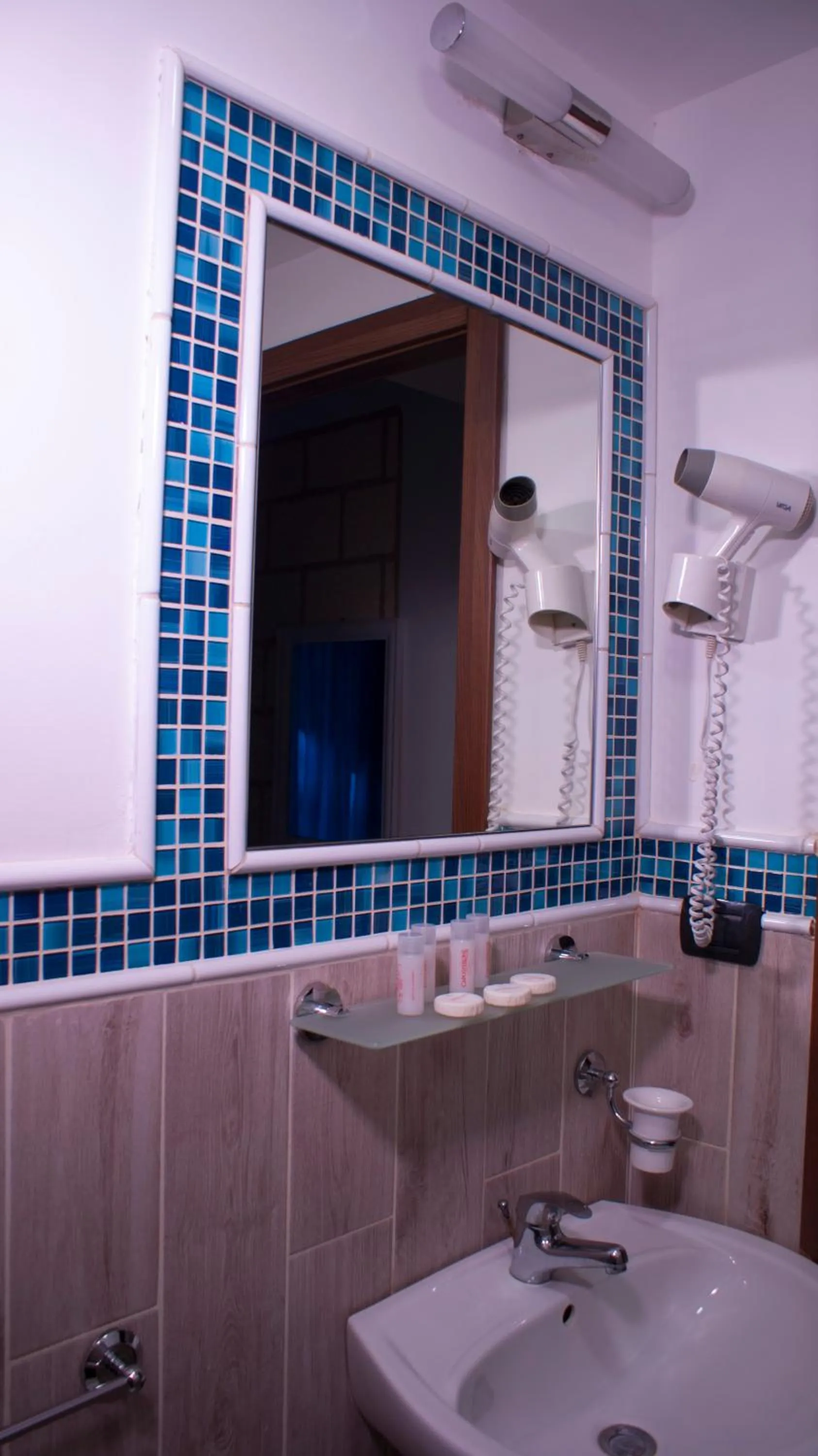 Bathroom in CapoSperone Resort