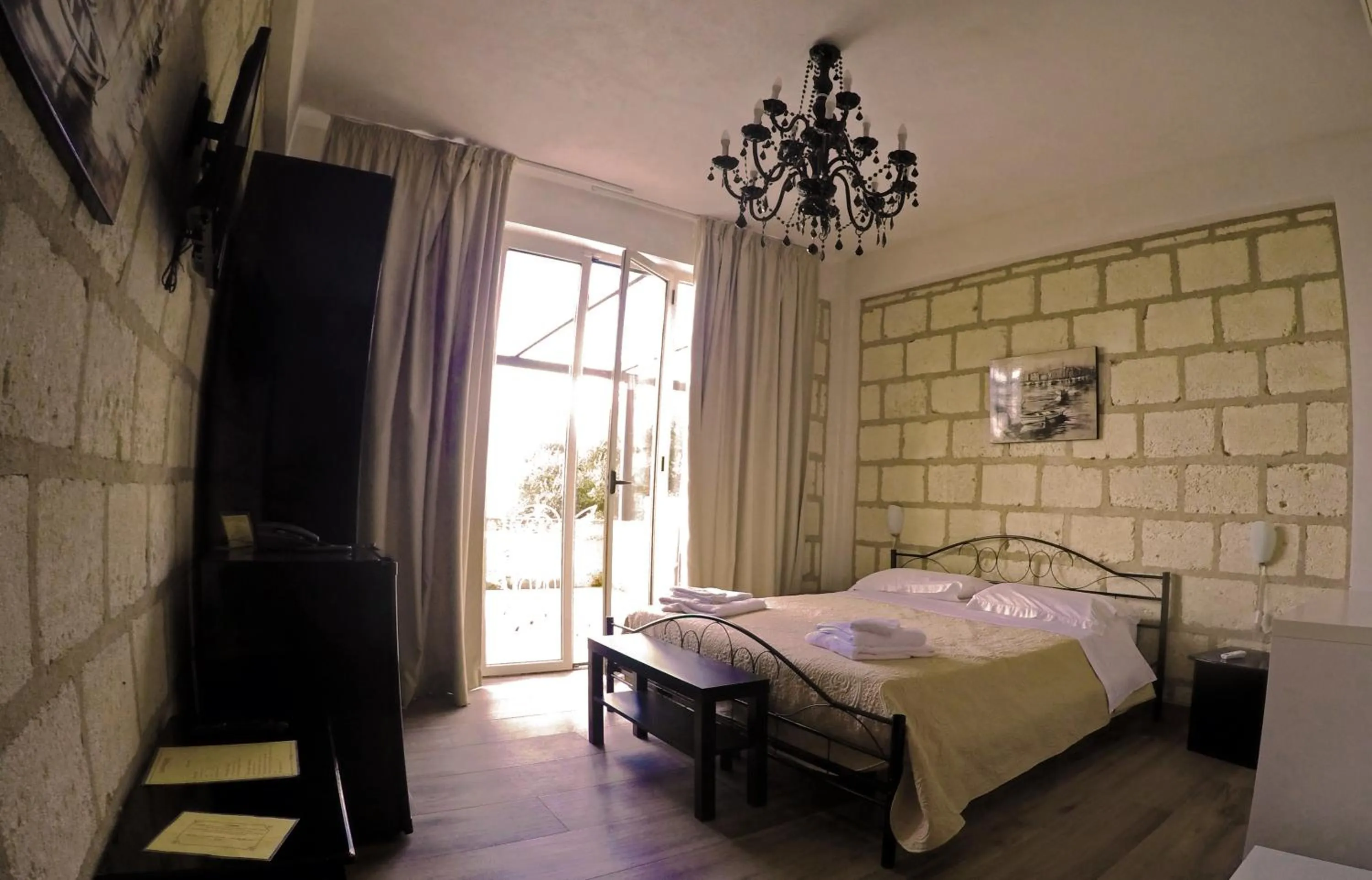 Photo of the whole room, Bed in CapoSperone Resort