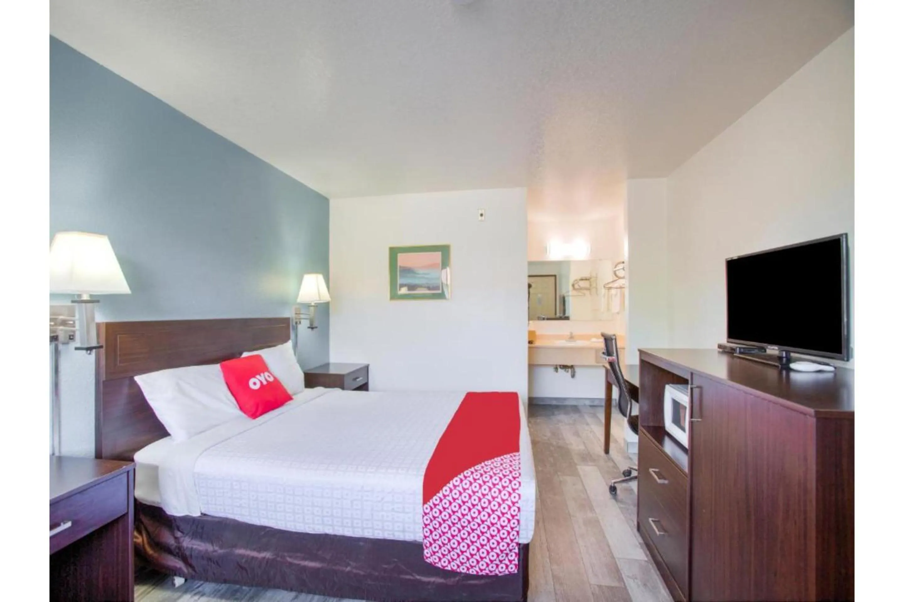 Bedroom, Bed in OYO Woodland Hotel and Suites