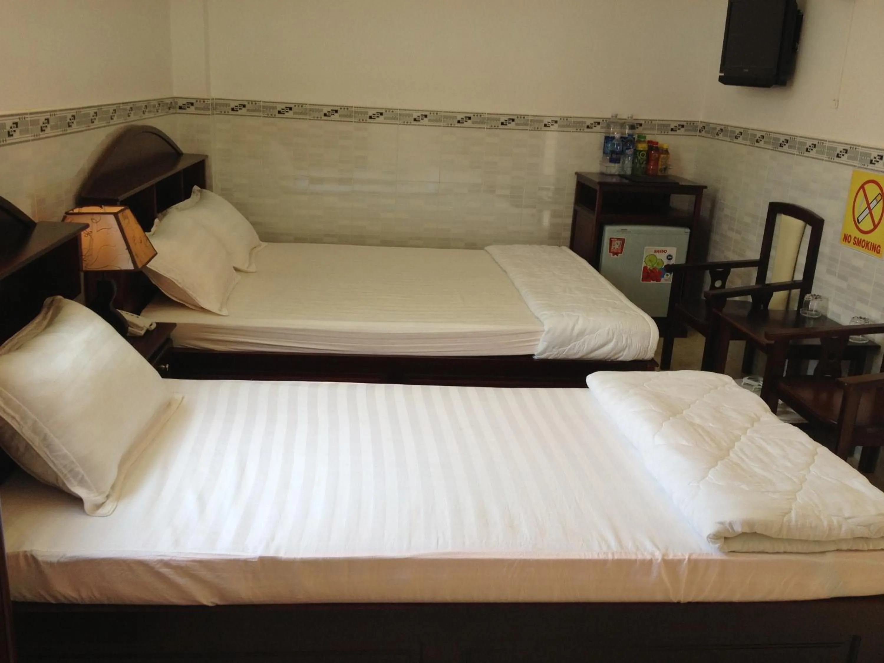 Bed in Huynh Lac Can Tho Hotel