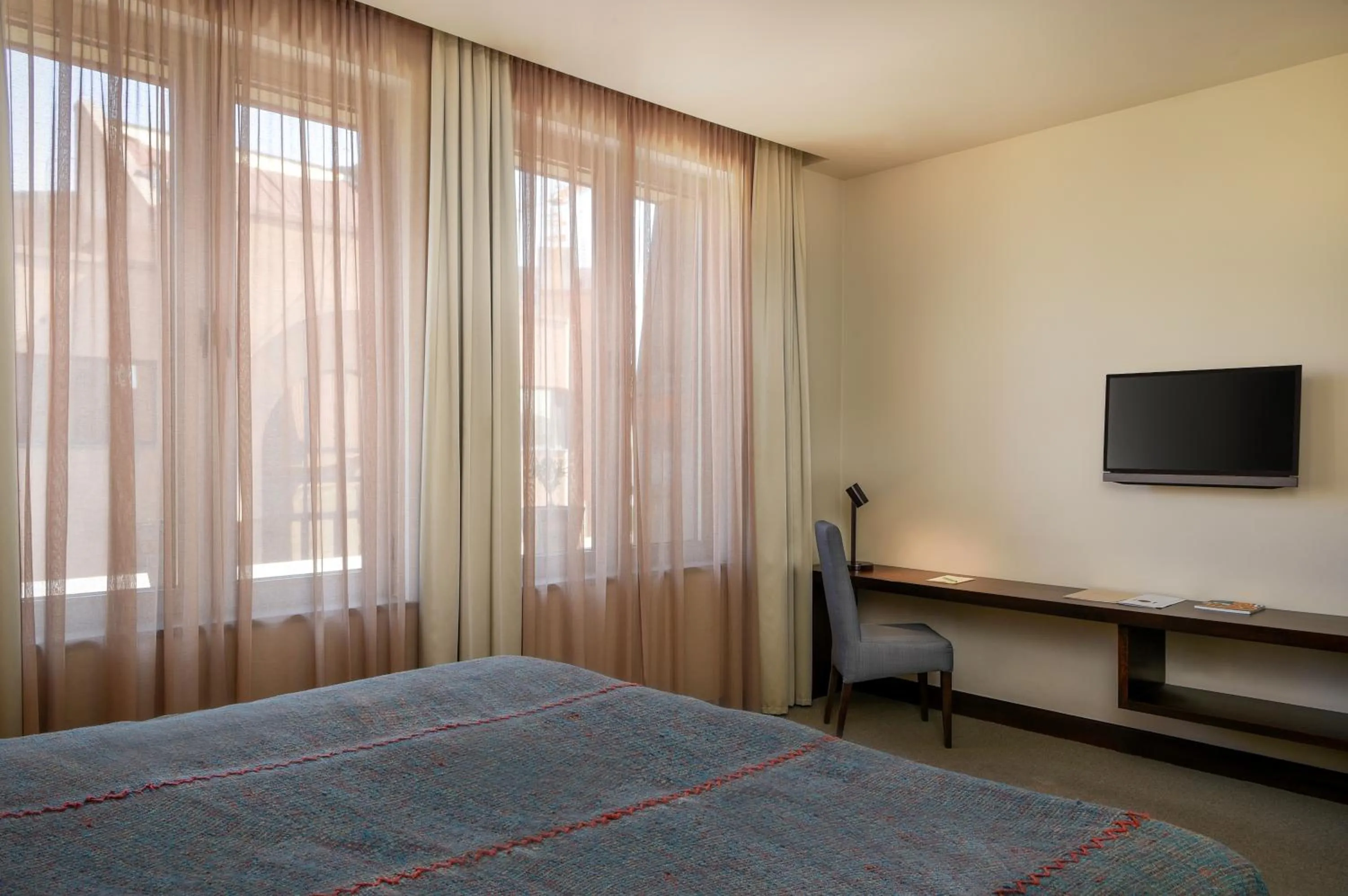 Bed in Tufenkian Historic Yerevan Hotel