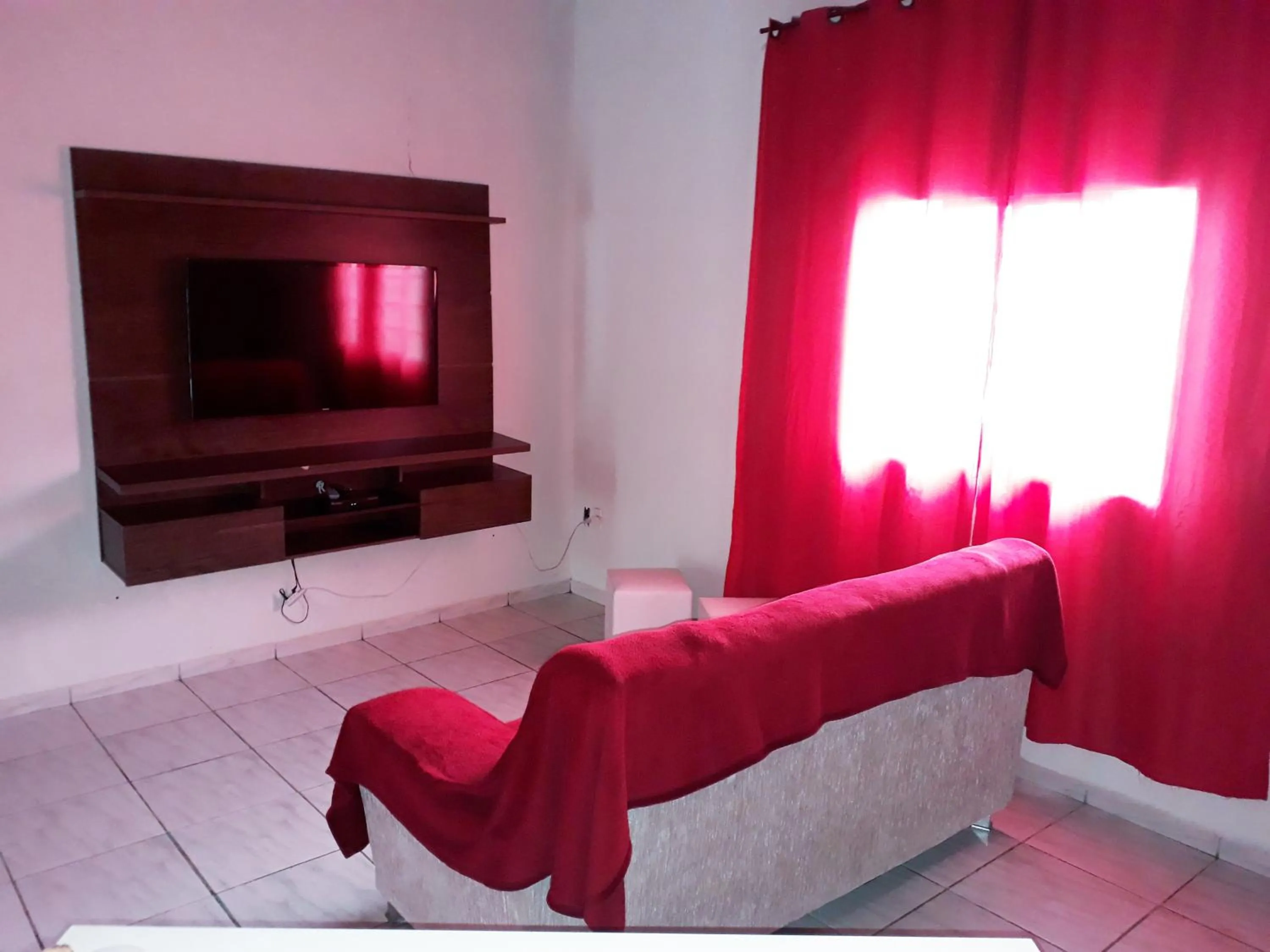 Communal lounge/ TV room, Bed in Pousada da Ana