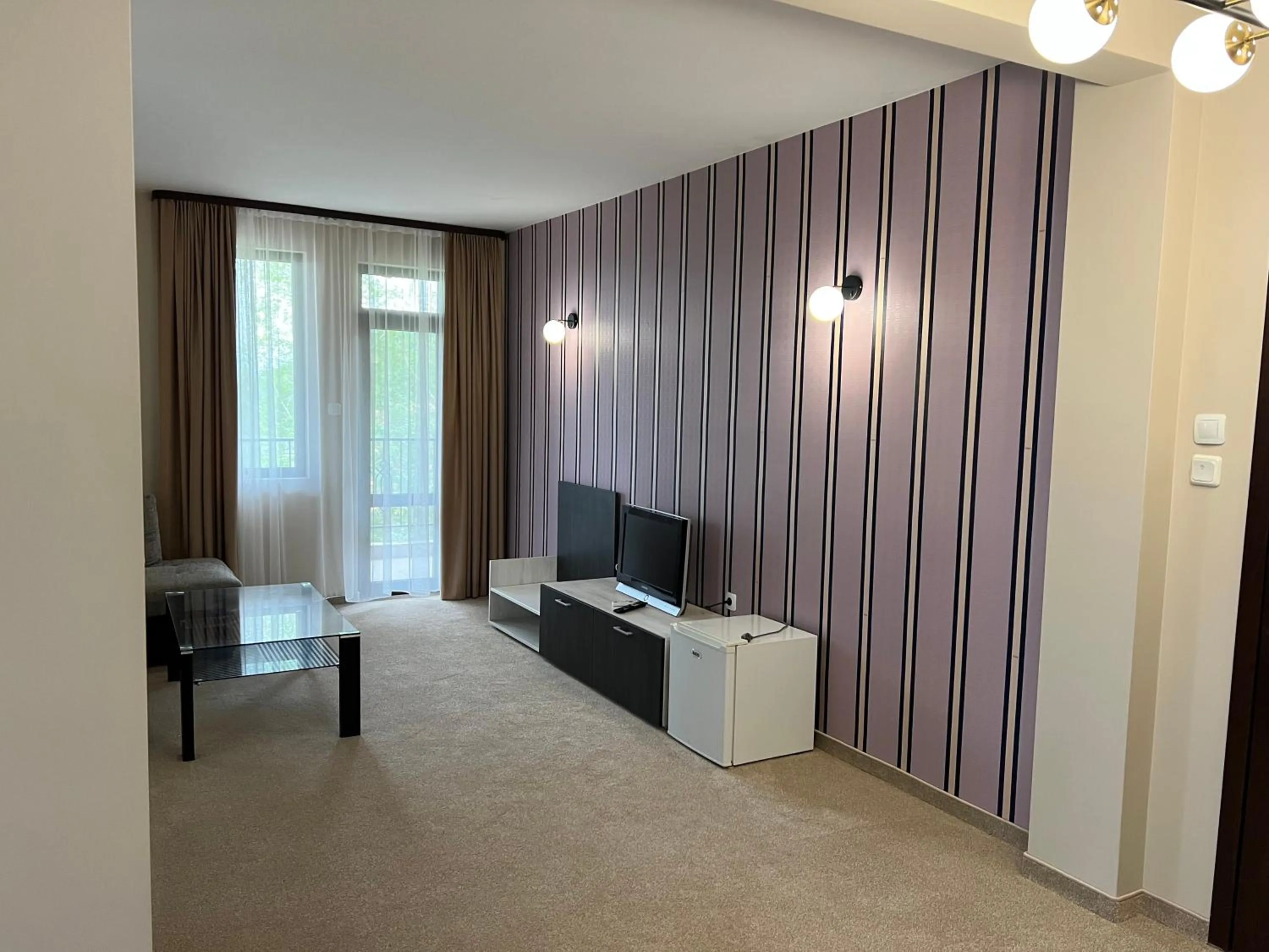 Communal lounge/ TV room in Chiflika Family Hotel