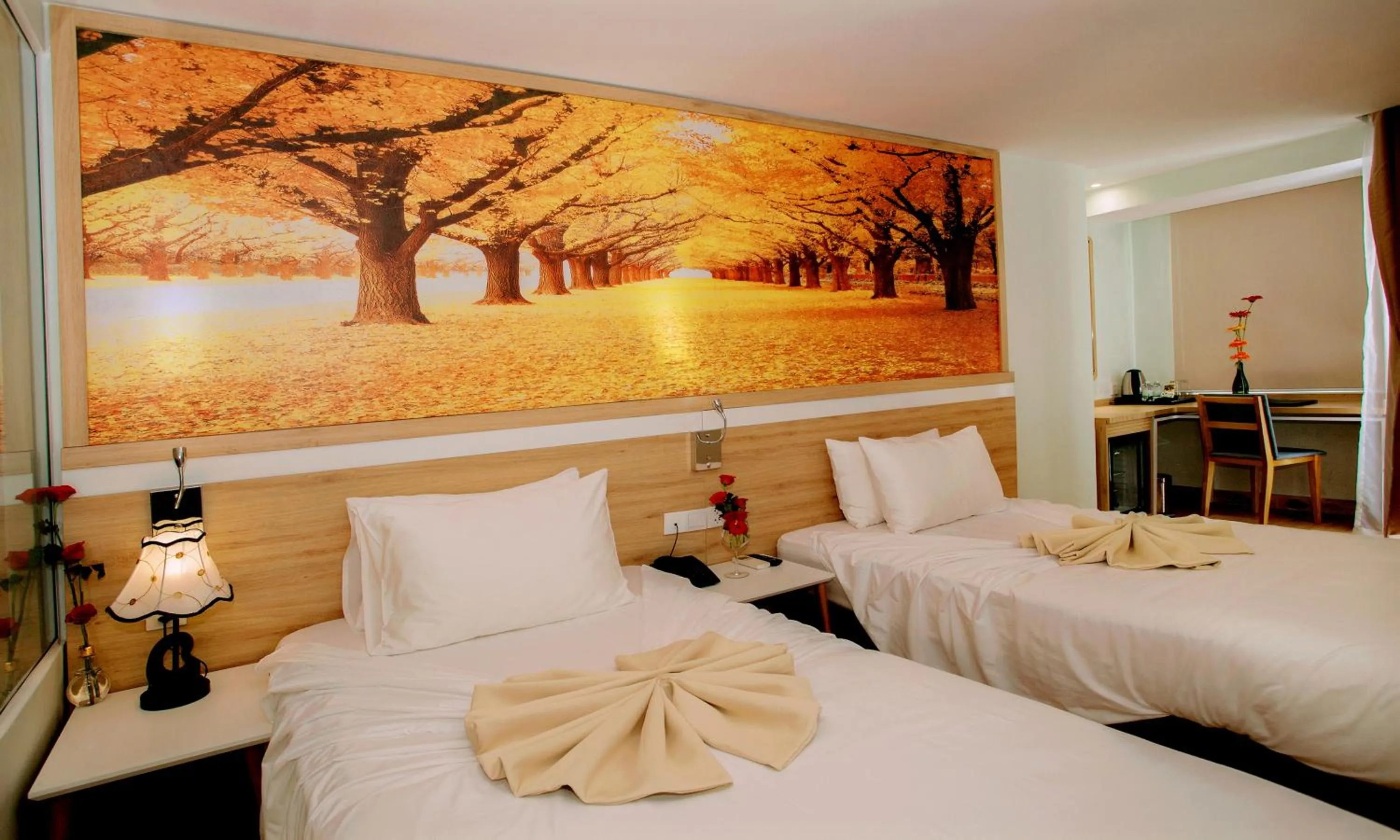 Bed in Royal HPM Hotel