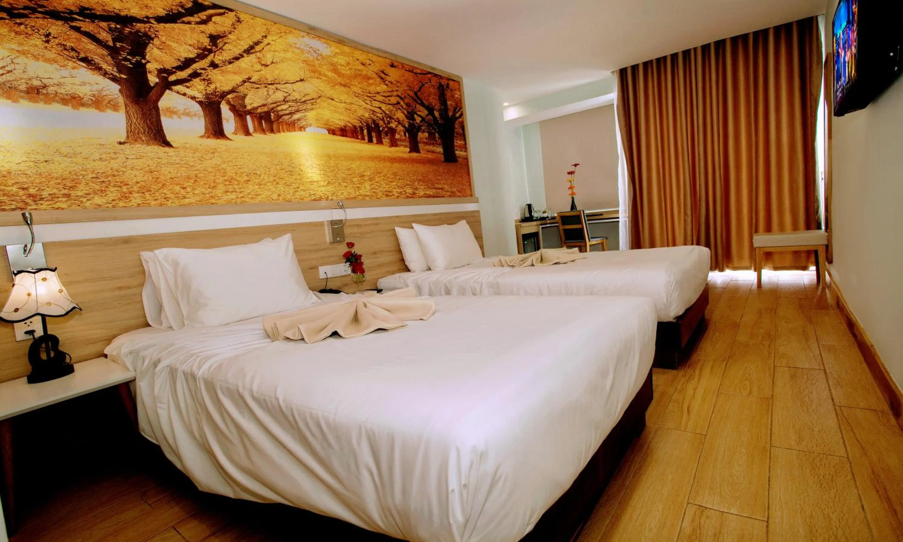 Bed in Royal HPM Hotel