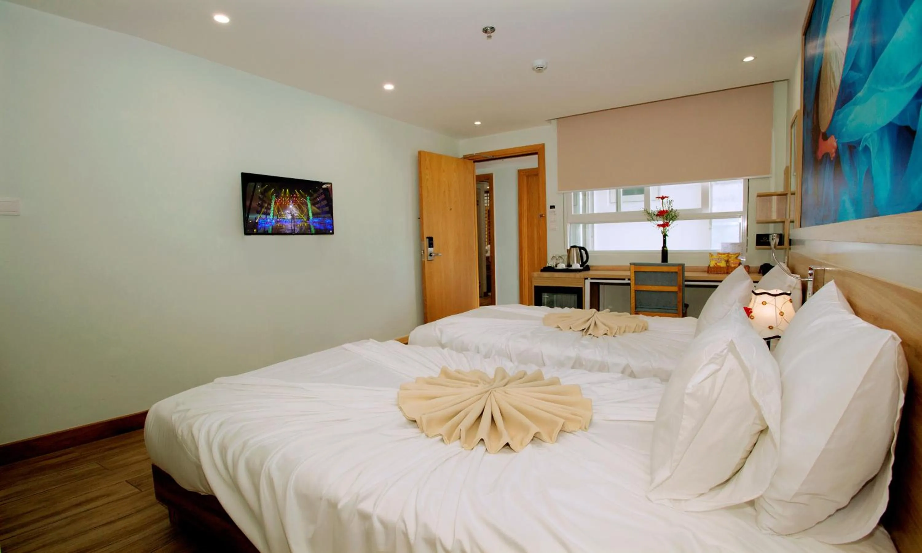 Bed in Royal HPM Hotel