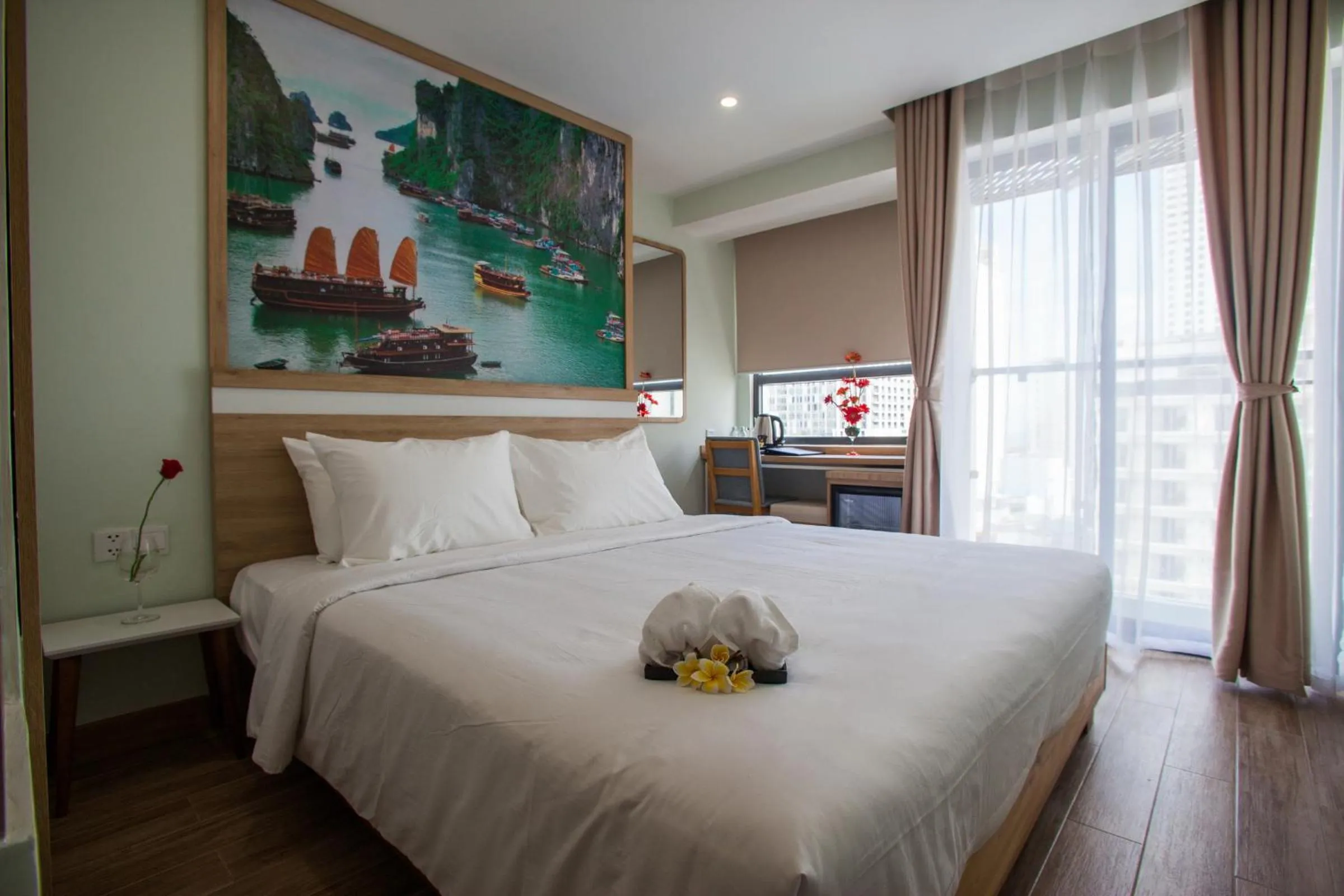 Bed in Royal HPM Hotel