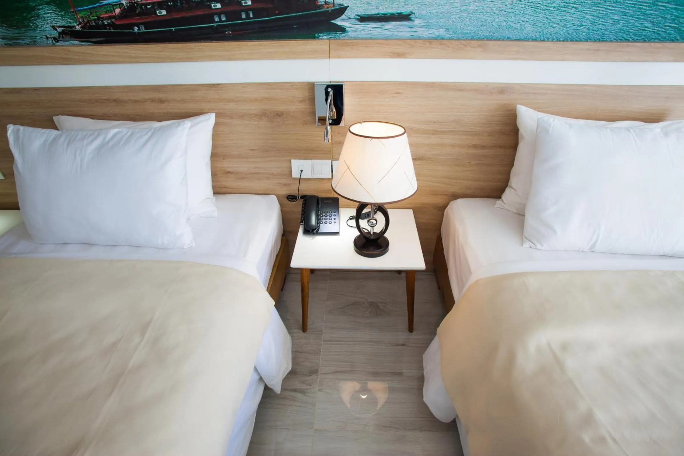 Bed in Royal HPM Hotel