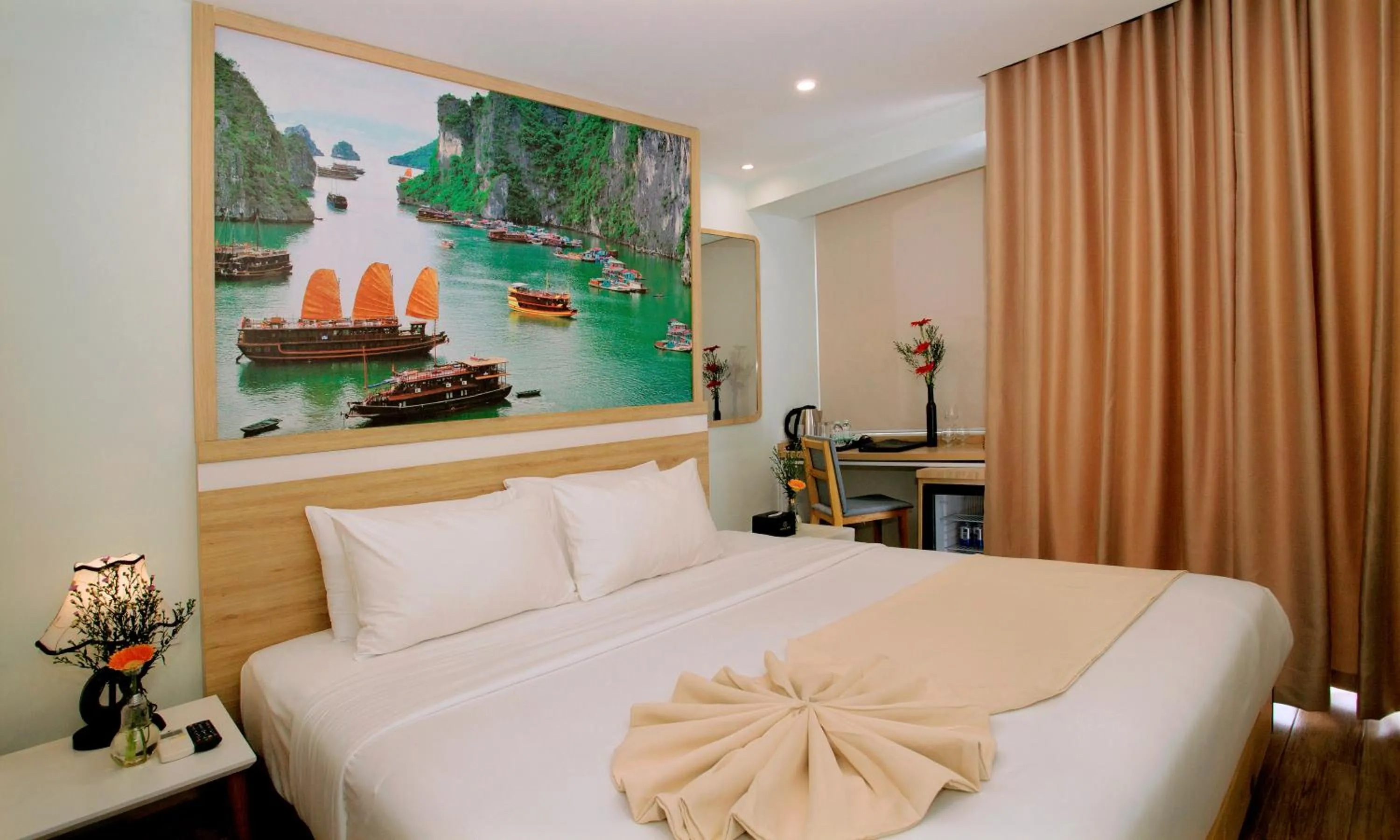 Bed in Royal HPM Hotel