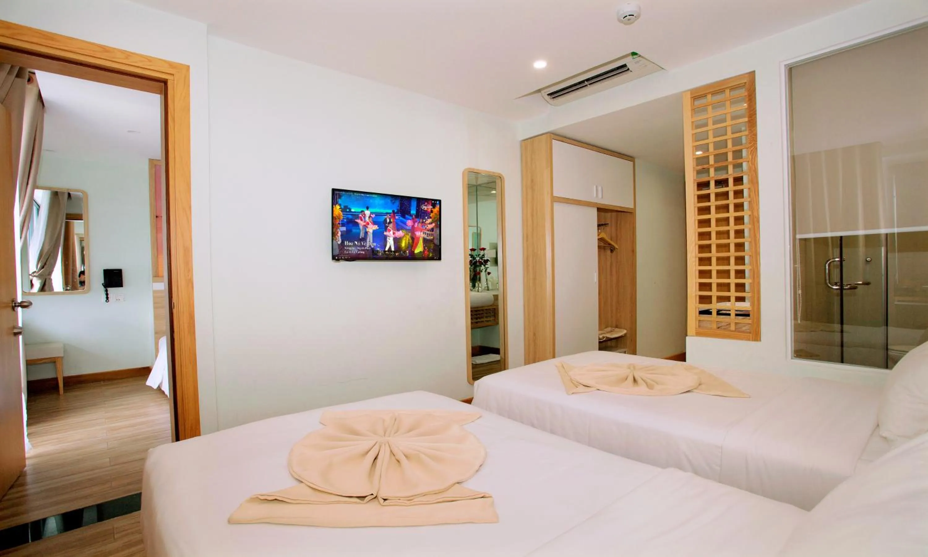 Bed in Royal HPM Hotel