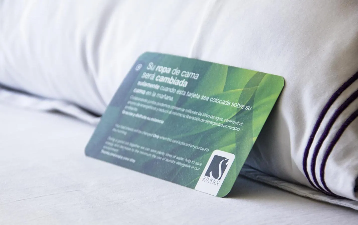 Text overlay, Bed in Sunec Hotel