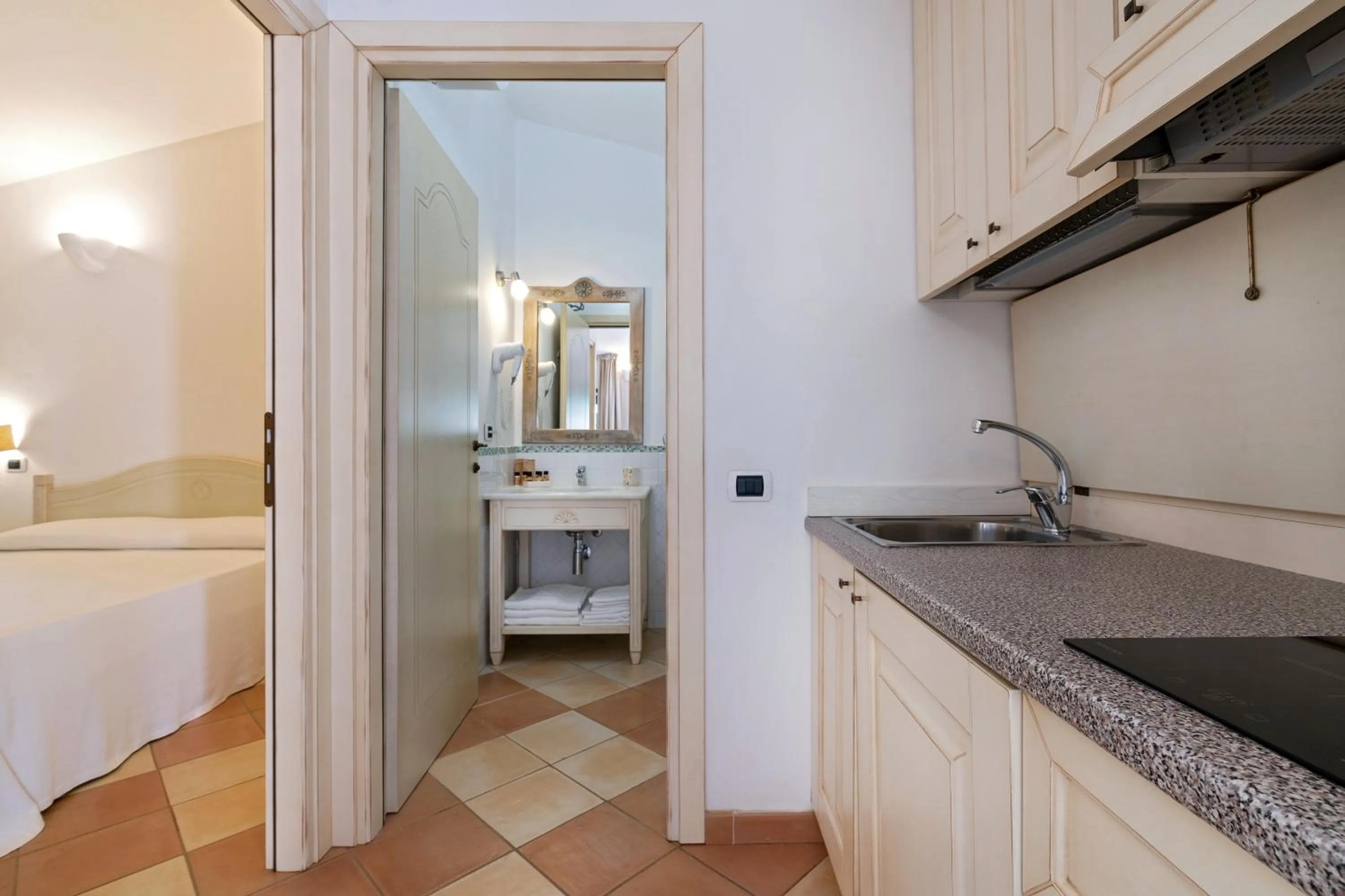 Bathroom, Bed in Porto Giunco Residence