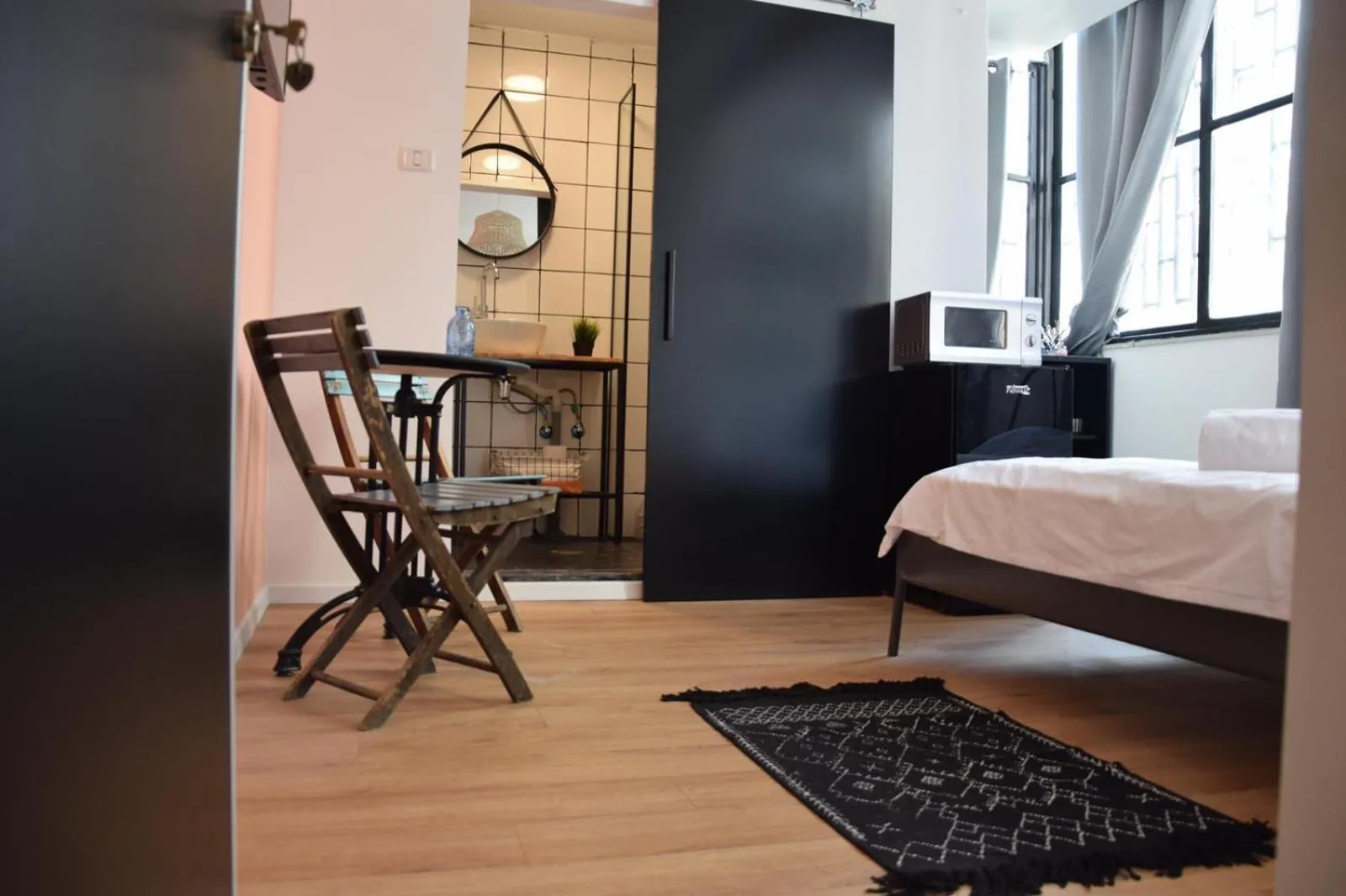 Photo of the whole room, Bed in LEVO Urban Studios