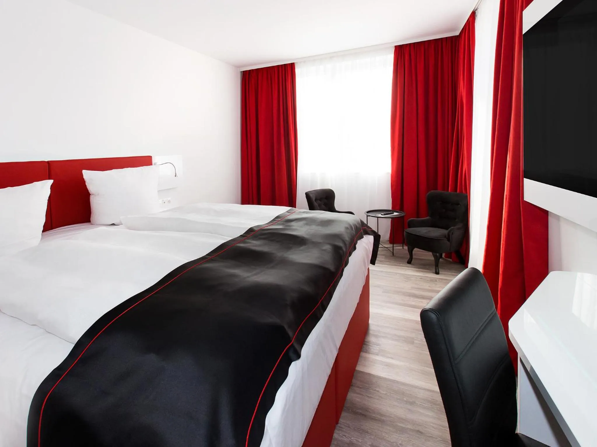 Photo of the whole room, Bed in DORMERO Hotel Salzgitter
