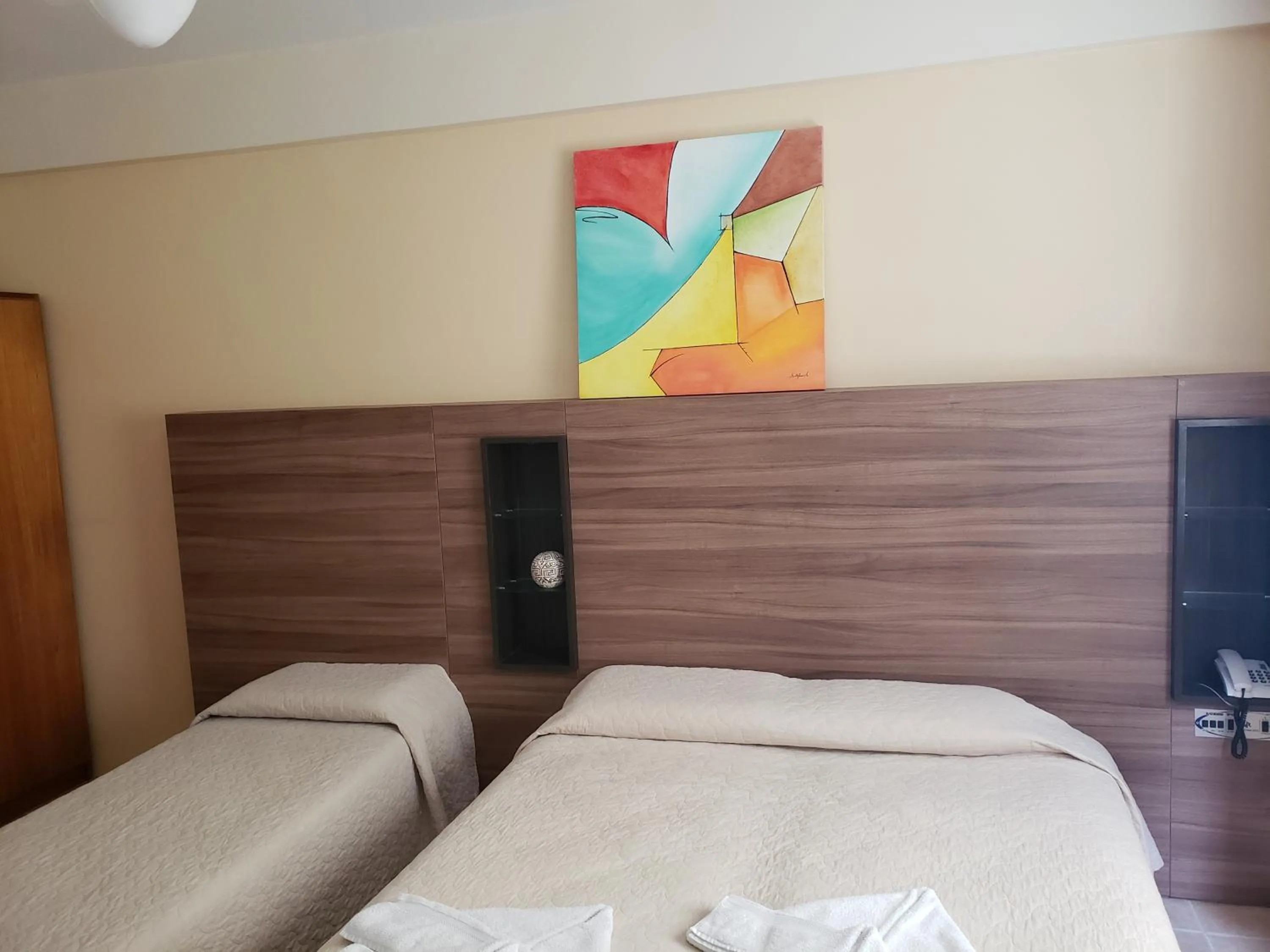 Bed in De Rose Praia Hotel