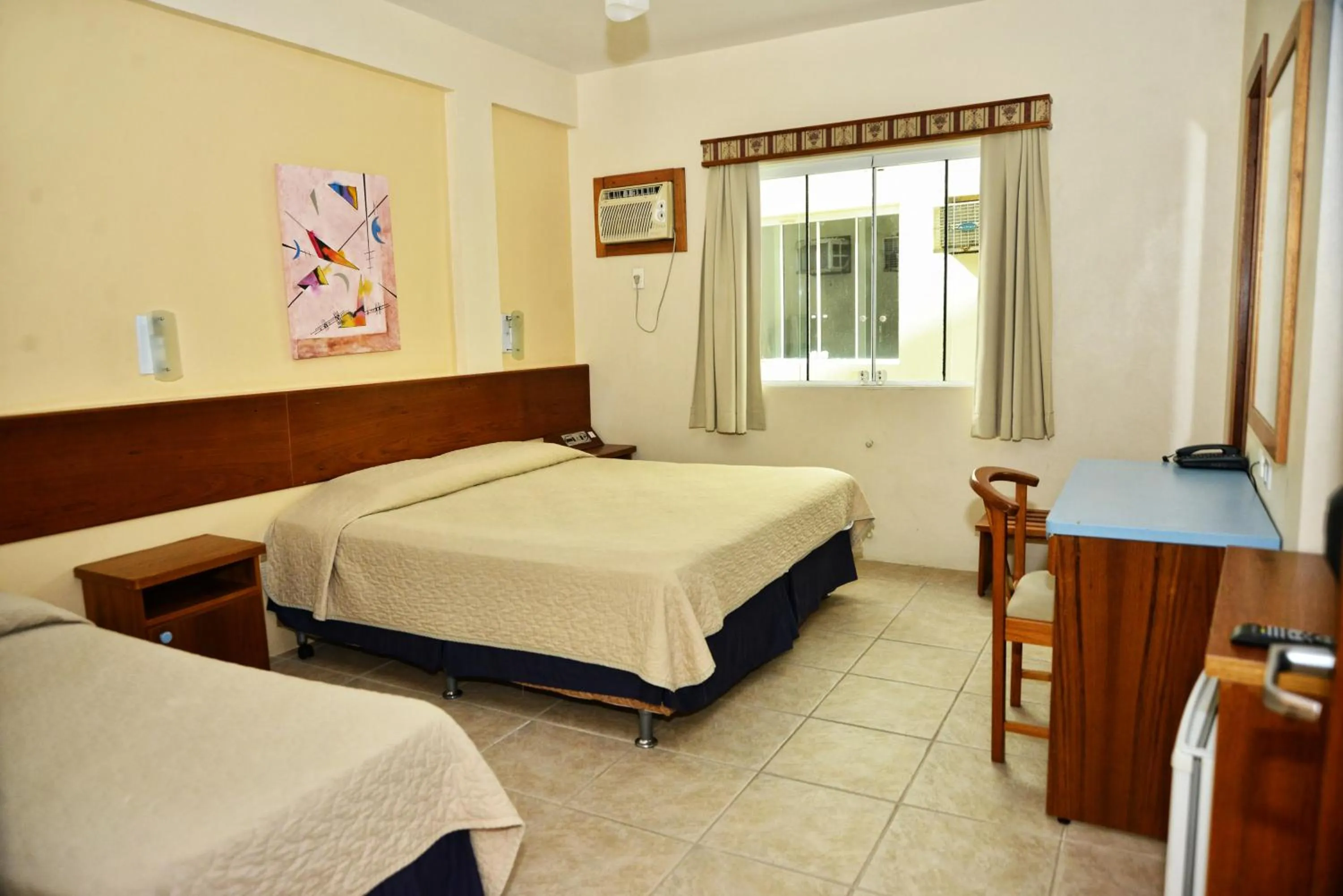 Bed in De Rose Praia Hotel