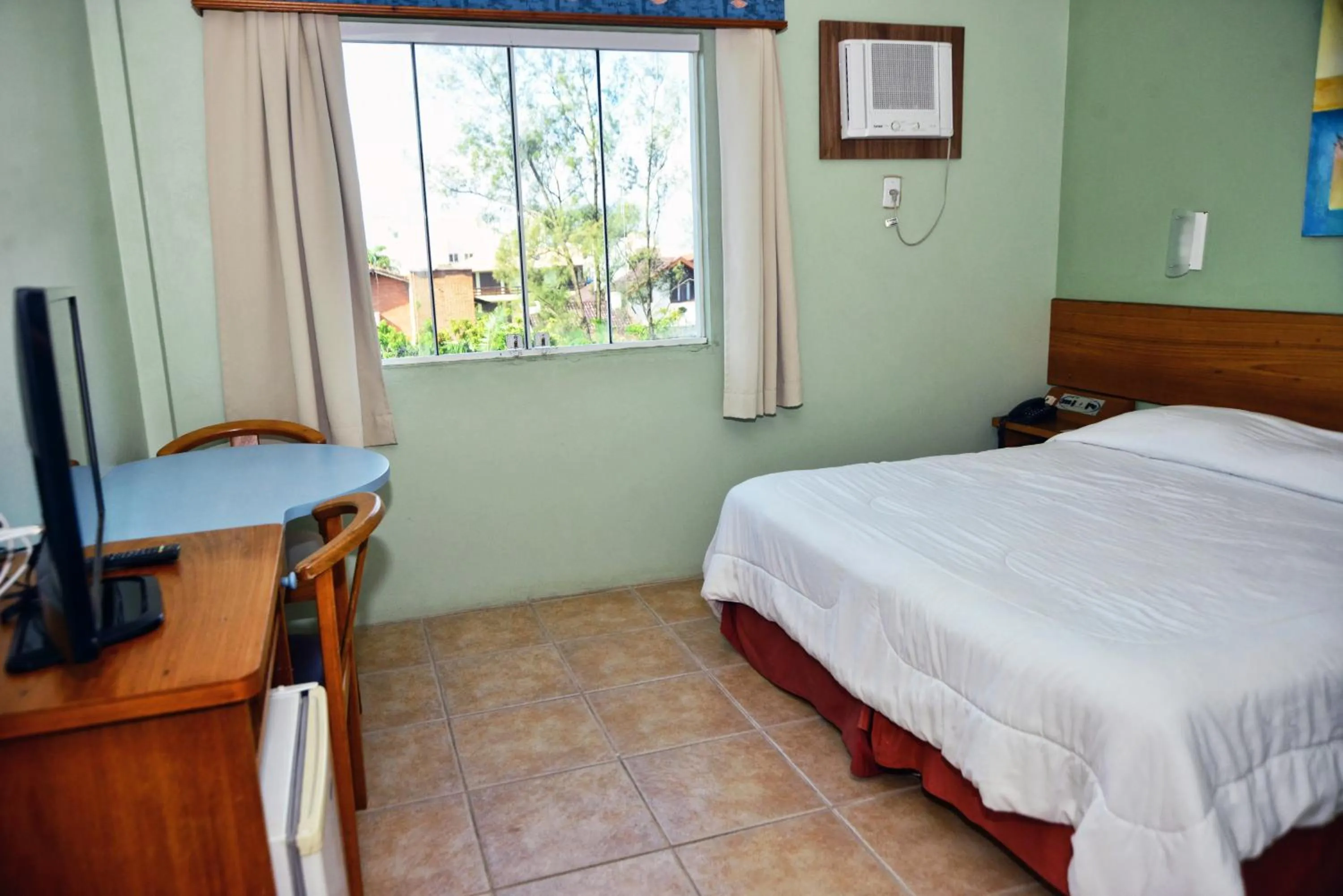 Bed in De Rose Praia Hotel