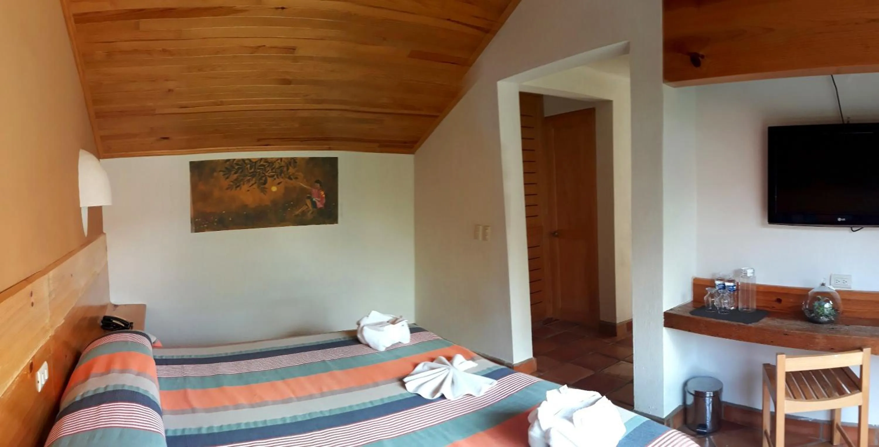 Bed in Axkan Arte Hotel