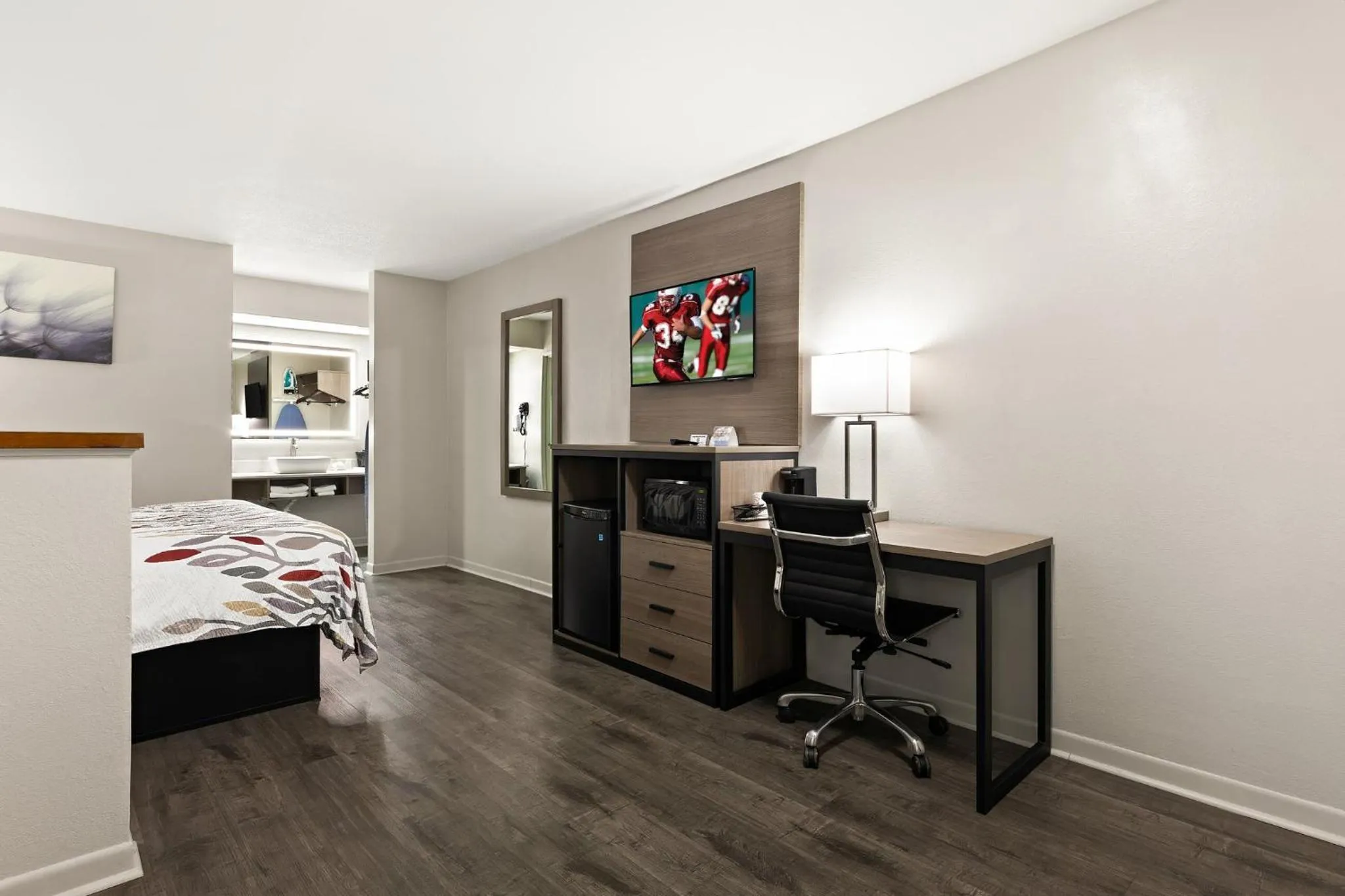 Photo of the whole room, Bed in Red Roof Inn & Suites Monroe, NC