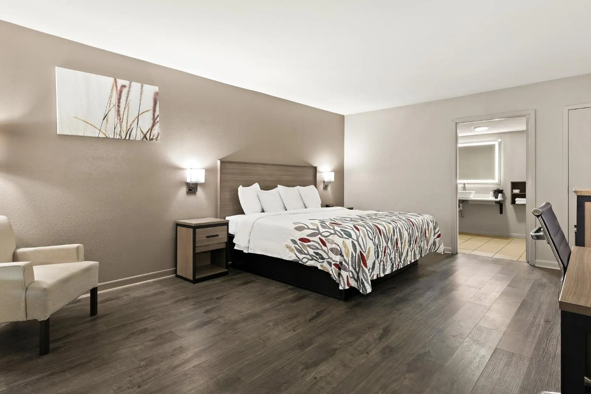 Photo of the whole room, Bed in Red Roof Inn & Suites Monroe, NC